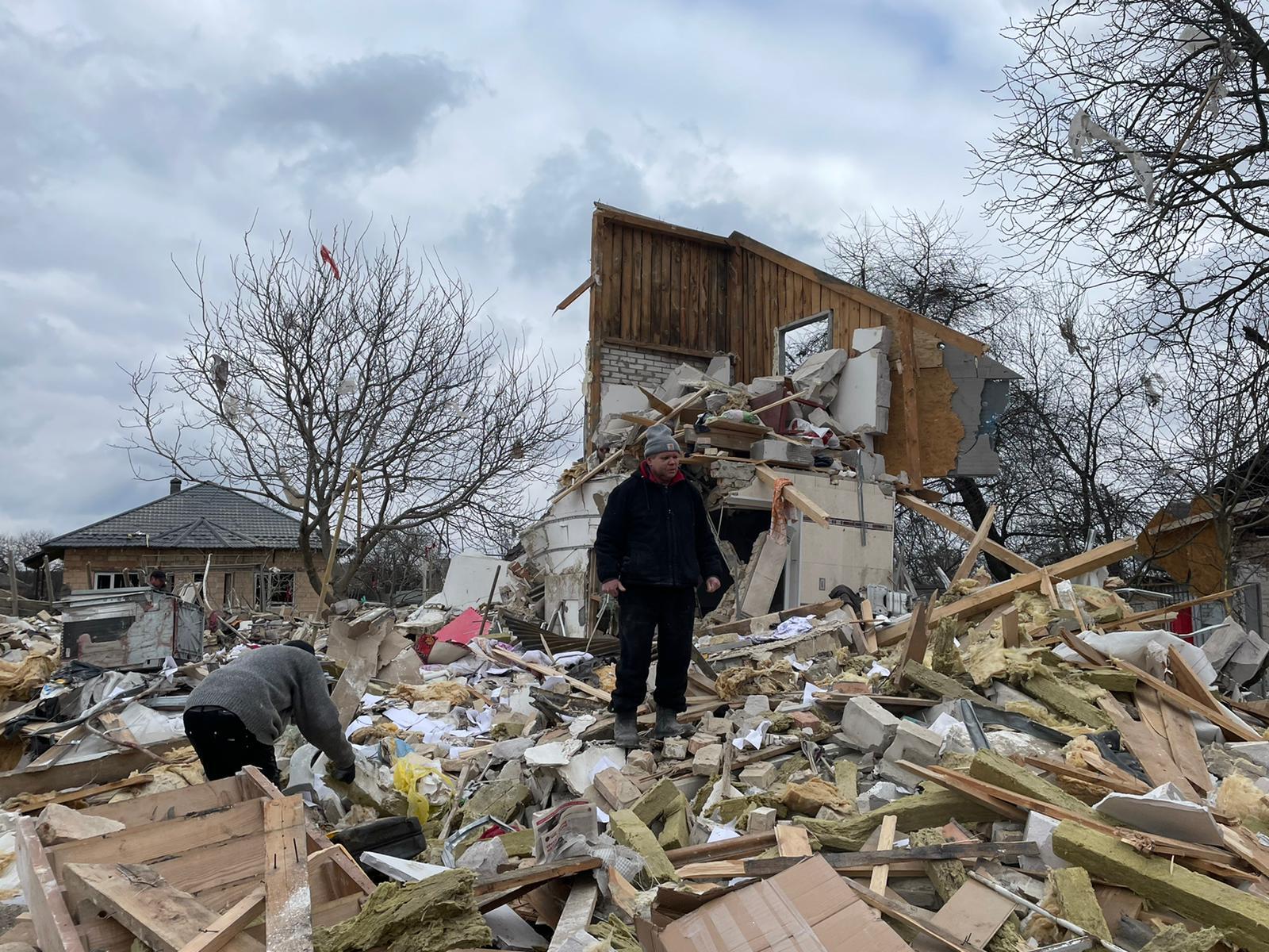 Igor stands in the ruins of his home in Markhalivka, Ukraine. 