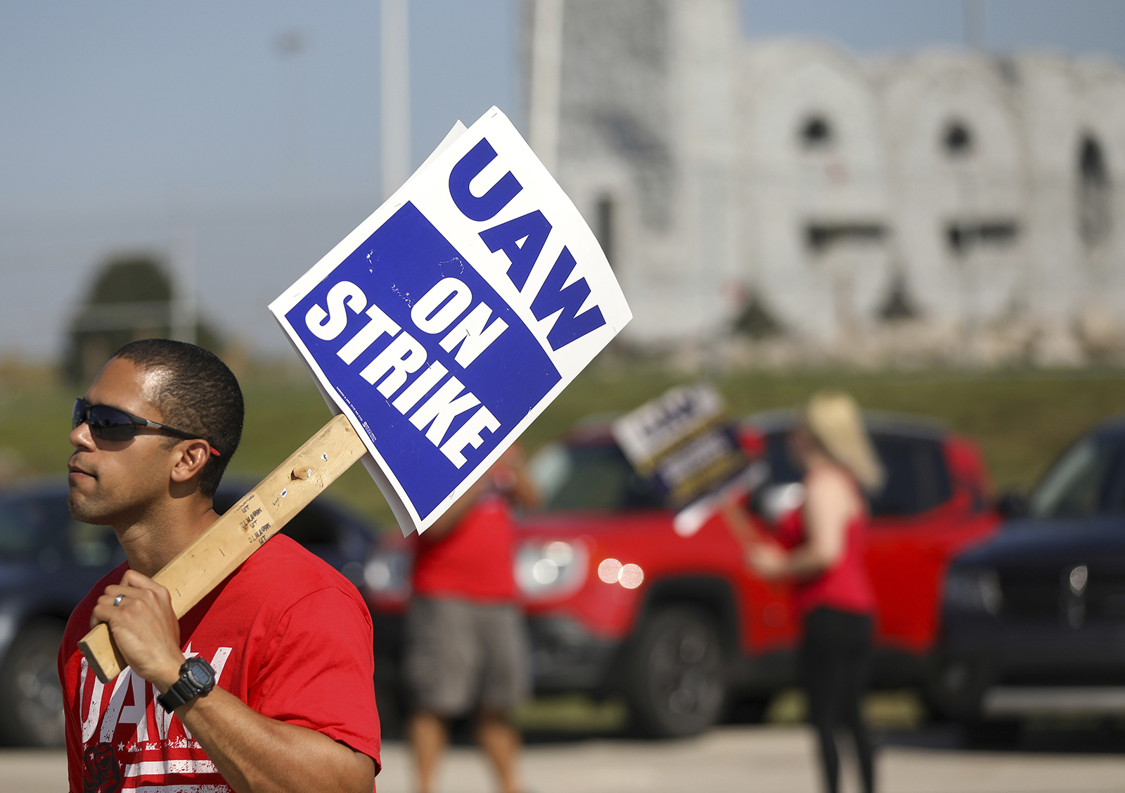 United Auto Workers members picket during the ongoing UAW strike at the Stellantis Toledo Assembly Complex on Monday in Toledo, Ohio. 