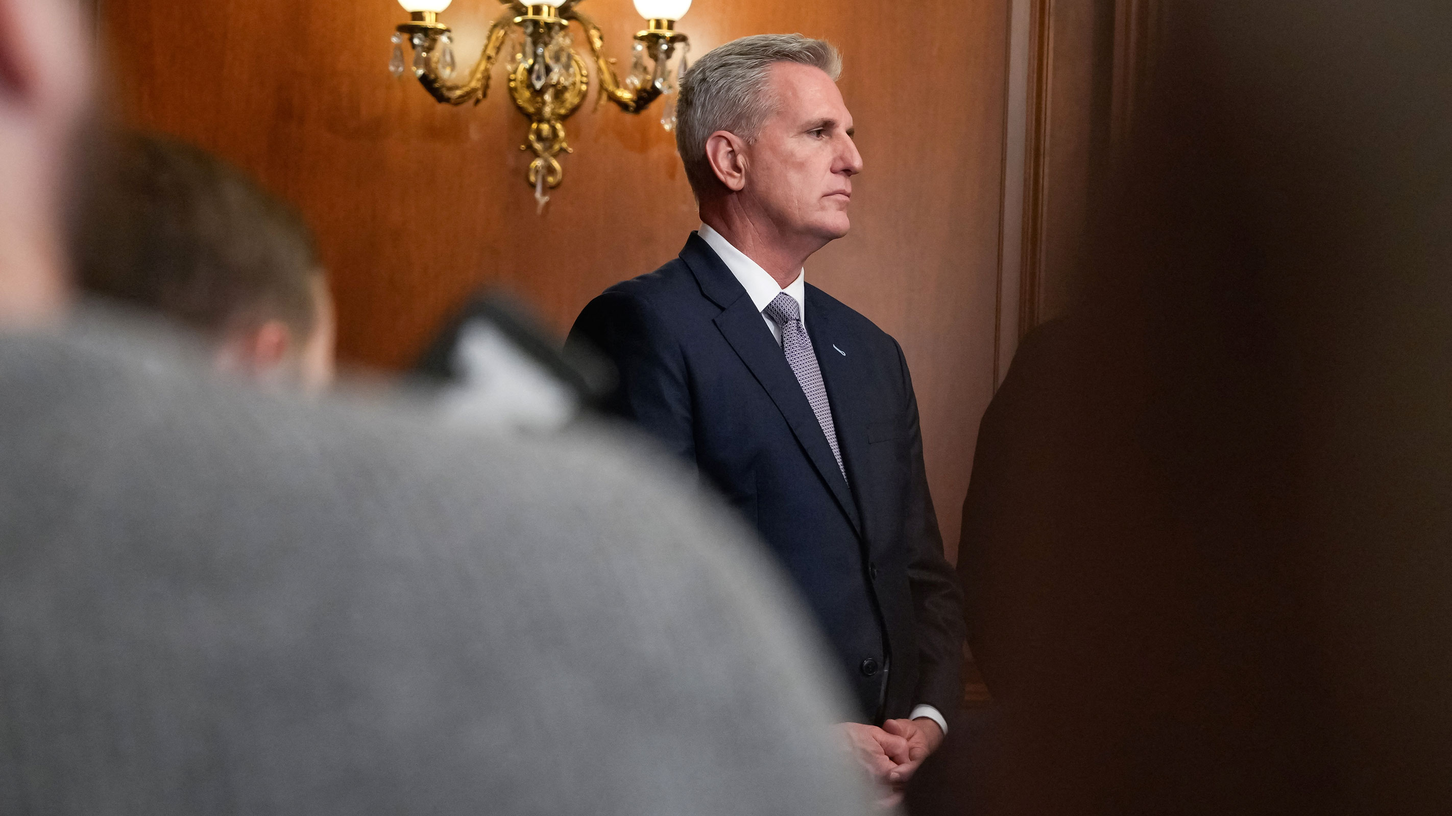 House Speaker Kevin McCarthy looks on in the US Capitol after the House of Representatives passed a stopgap government funding bill to avert an immediate government shutdown, on Capitol Hill in Washington, DC, September 30. 
