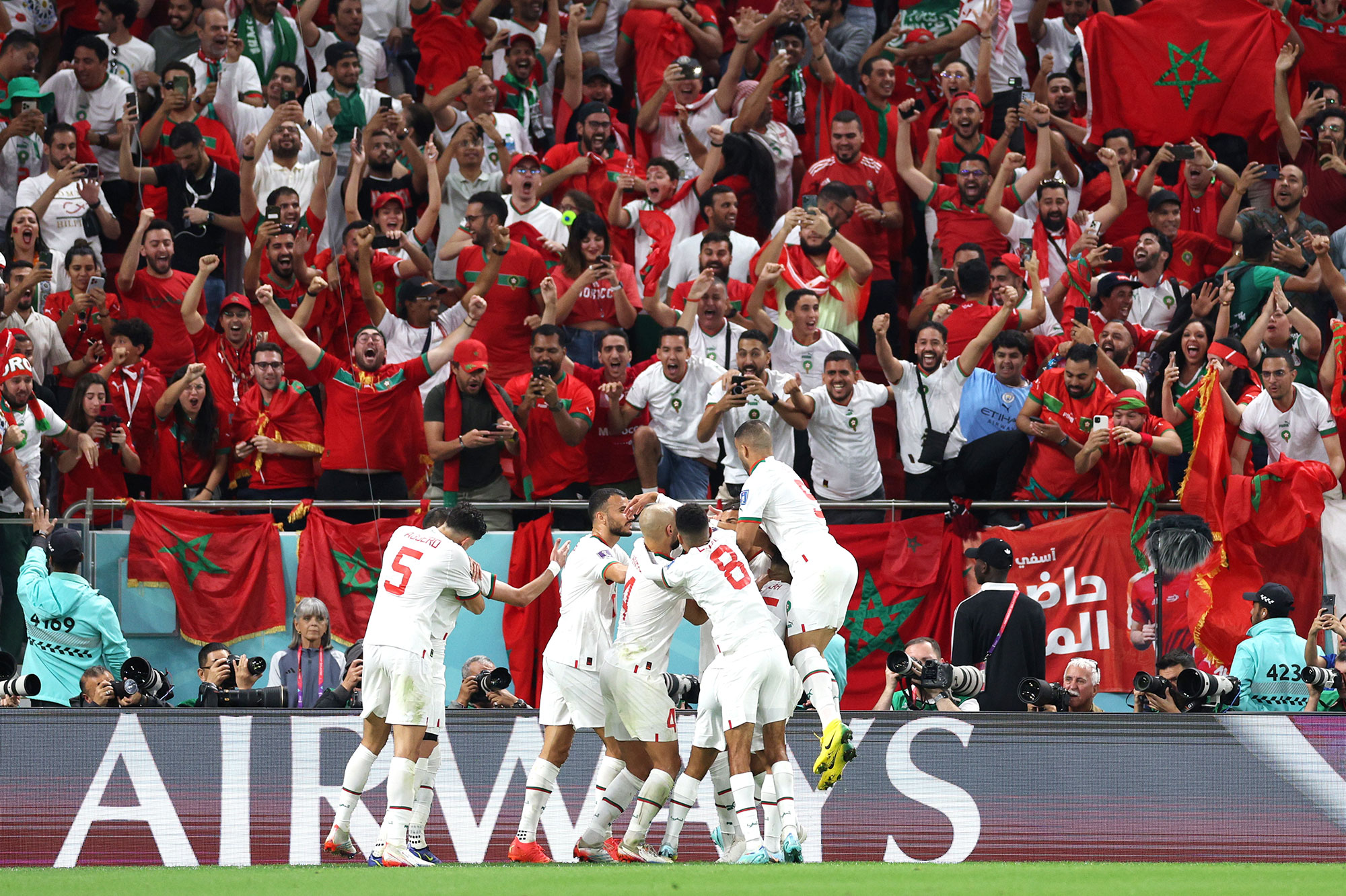 Morocco players and fans celebrate after Abdelhamid Sabiri scored against Belgium on Sunday. 