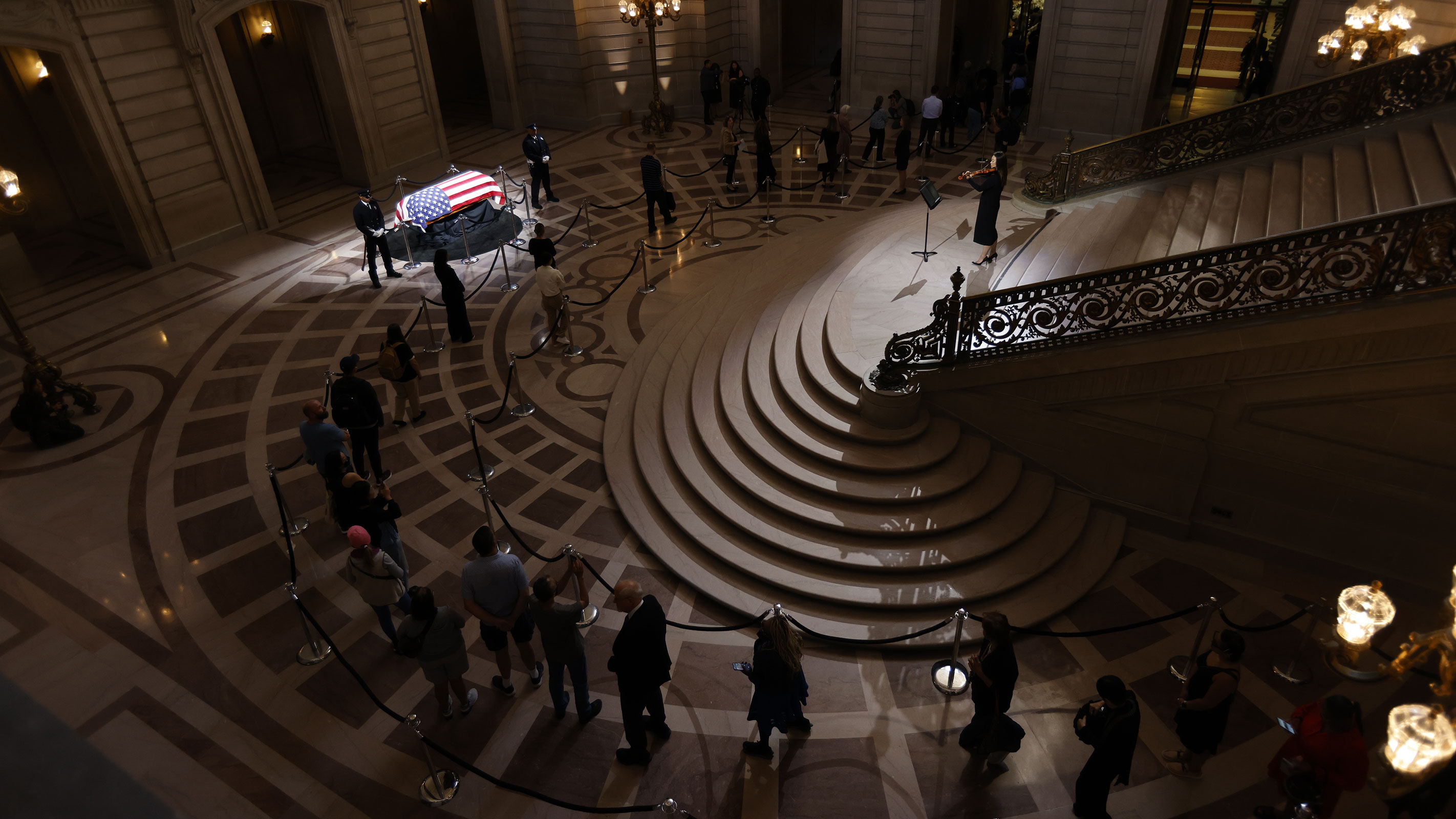 Members of the public wait in line to pay their respects to the late Sen. Dianne Feinstein.
