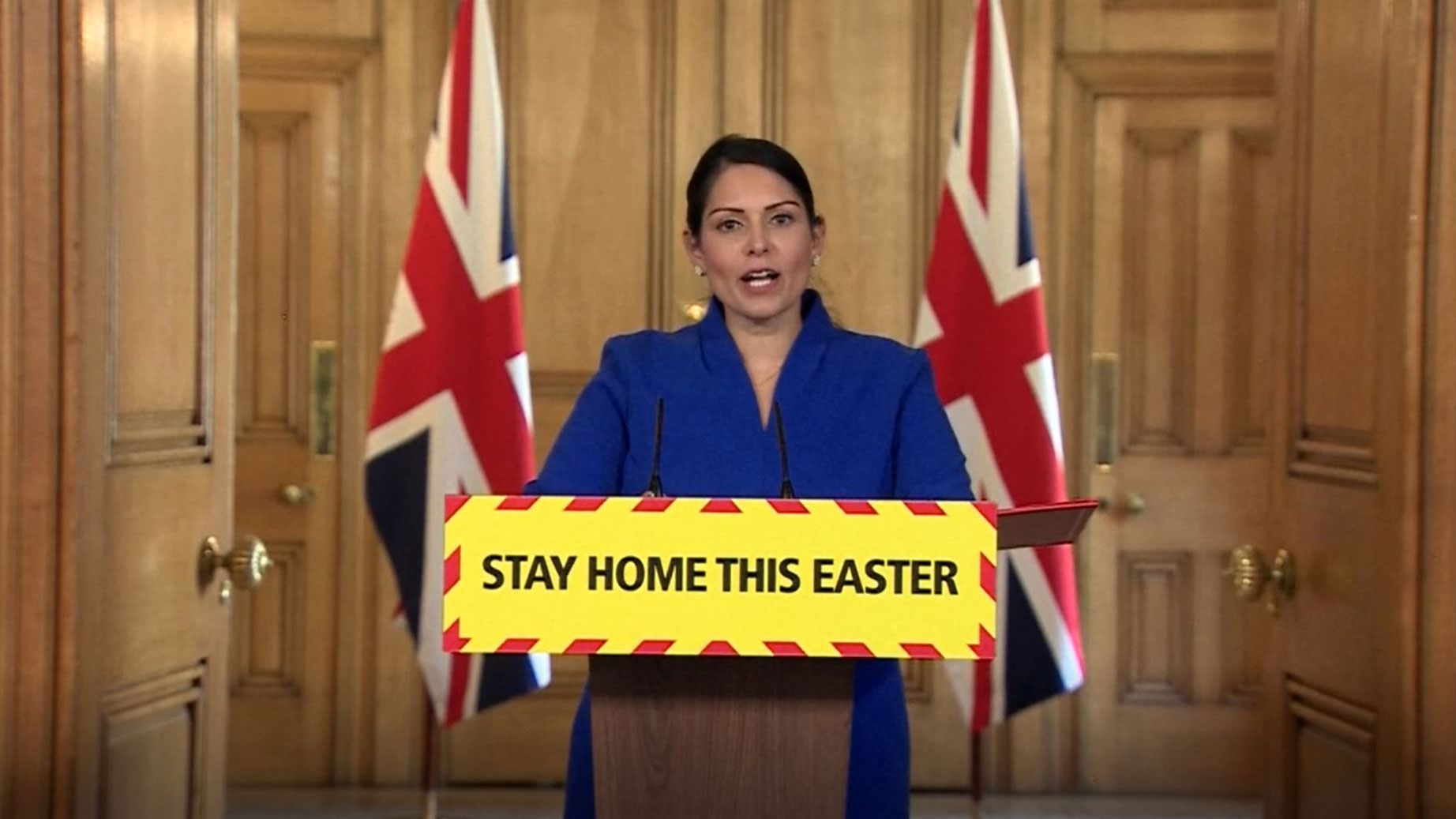 UK Home Secretary Priti Patel speaks from Downing Street in London on April 11.