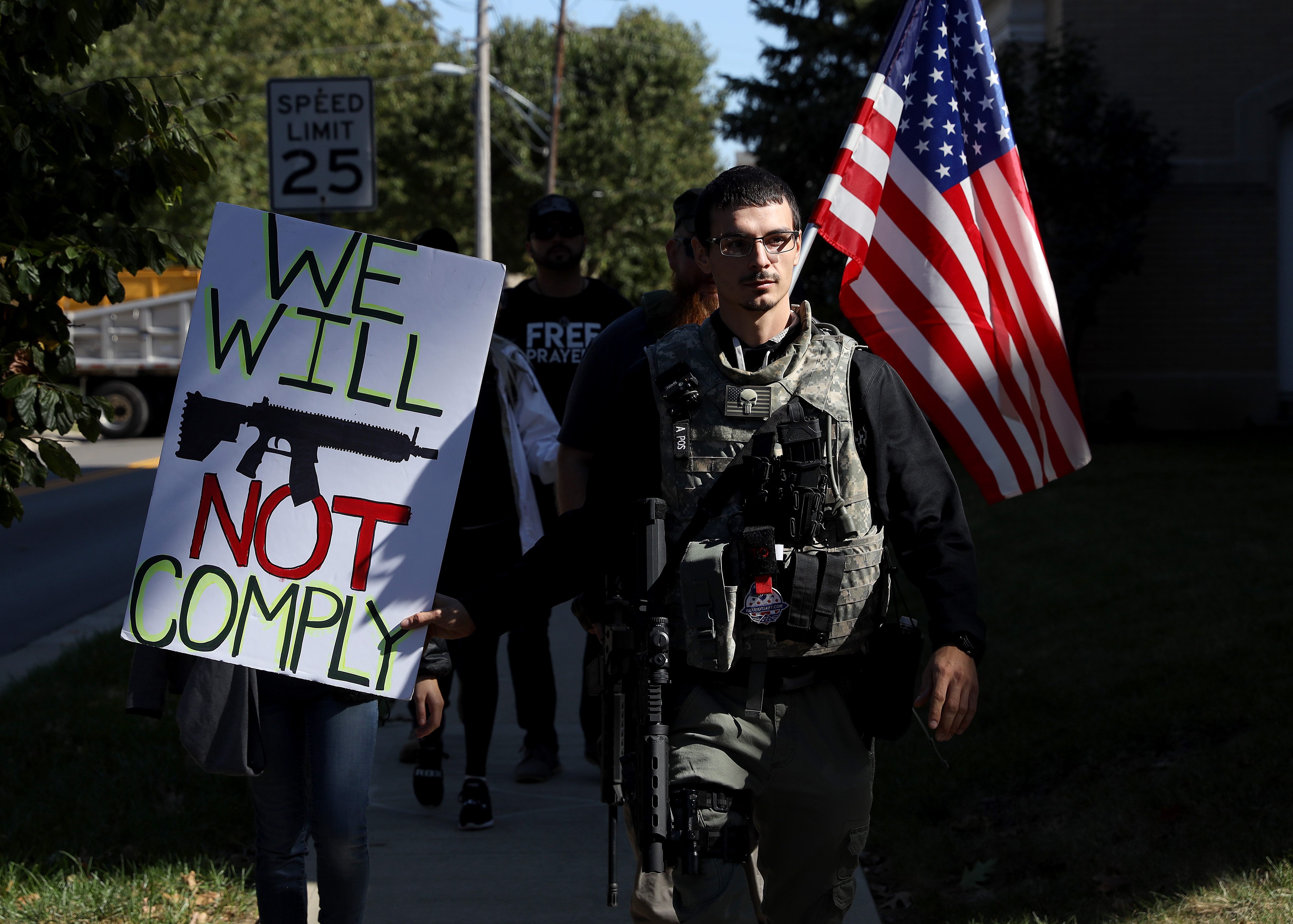 Gun rights supporters walk to the campus of Otterbein University on Oct. 15, 2019 in Westerville, Ohio.
