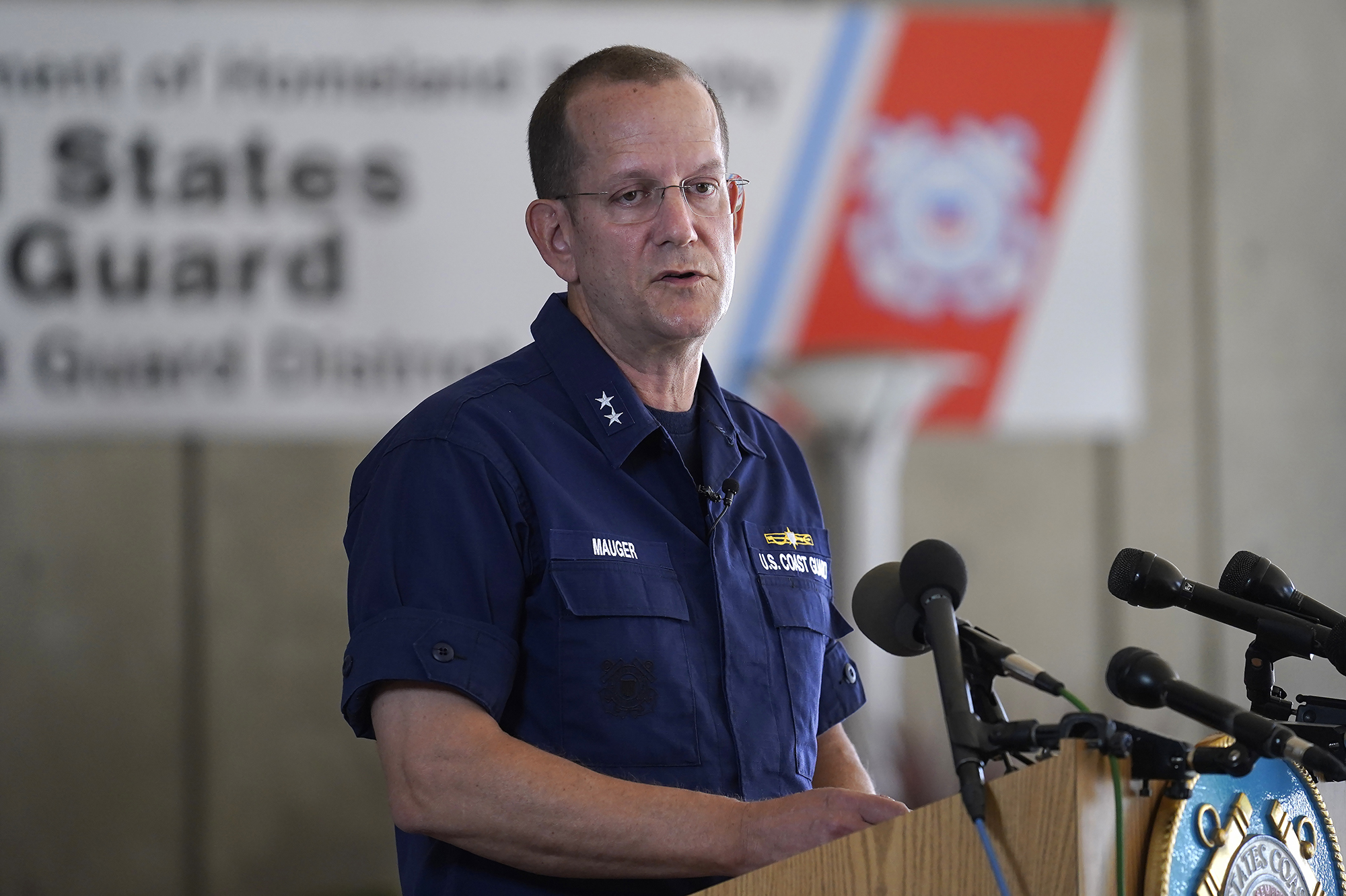 U.S. Coast Guard Rear Adm. John Mauger, commander of the First Coast Guard District, speaks to the media, on June 19, in Boston. 