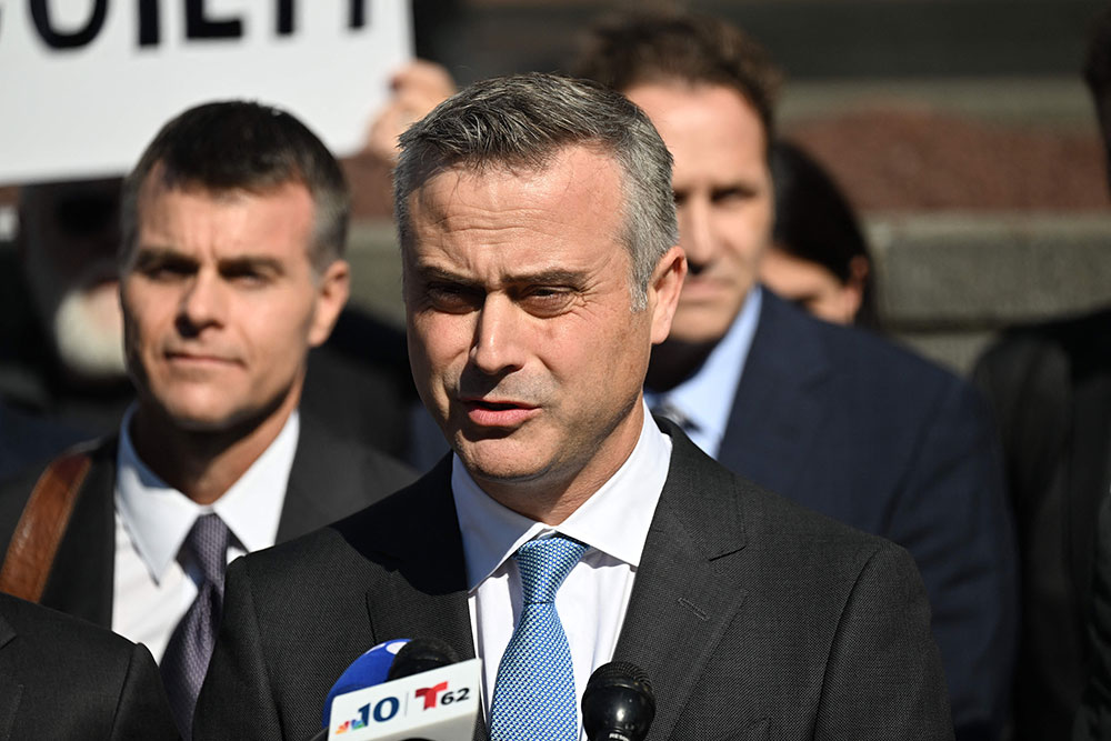 Dominion CEO John Poulos, joined by members of the Dominion Voting Systems legal team, speaks outside the Leonard Williams Justice Center in Wilmington, Delaware, on April 18.