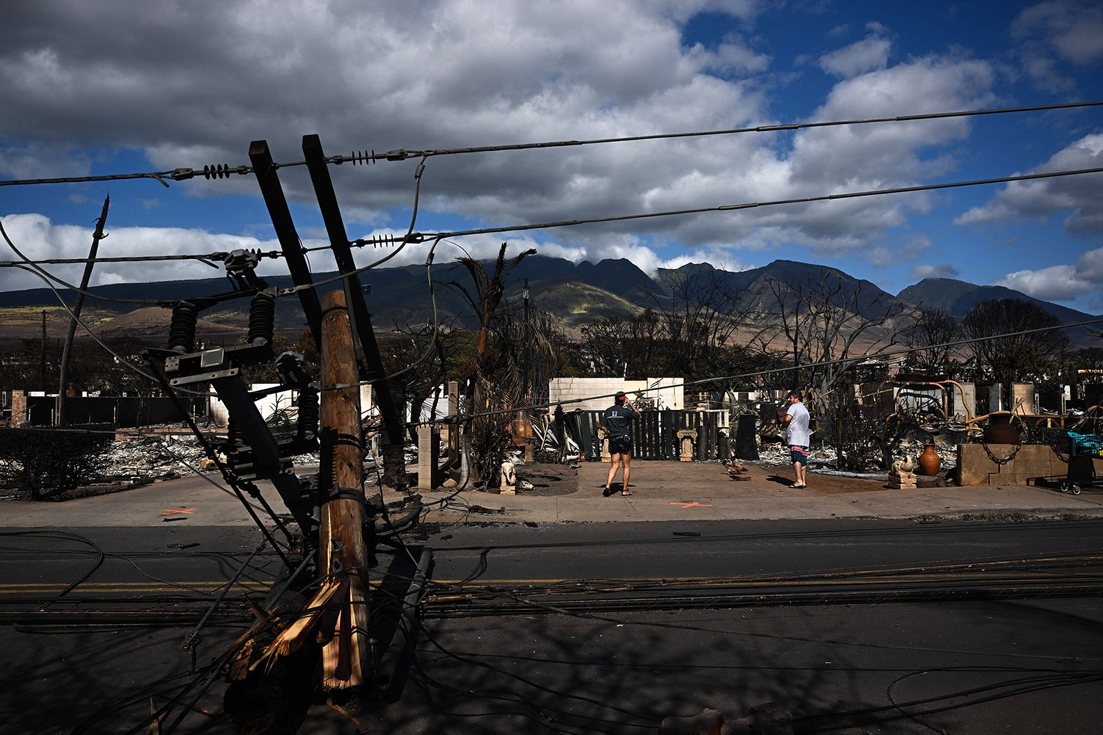 Downed power lines block a road in Lahaina, Hawaii, on August 11.