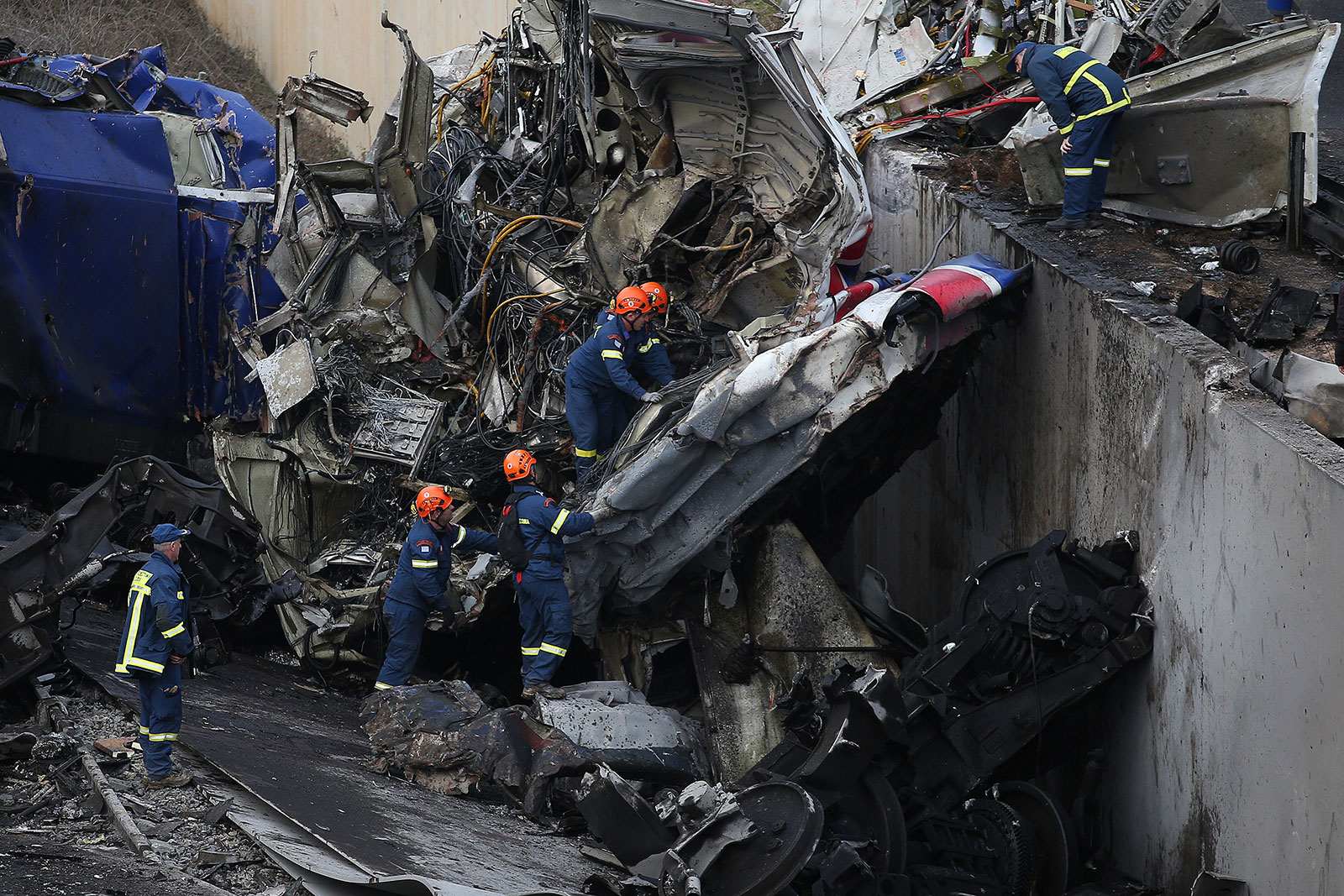 Rescuers operate next to debris of a train after a crash near the city of Larissa, Greece, on March 1.