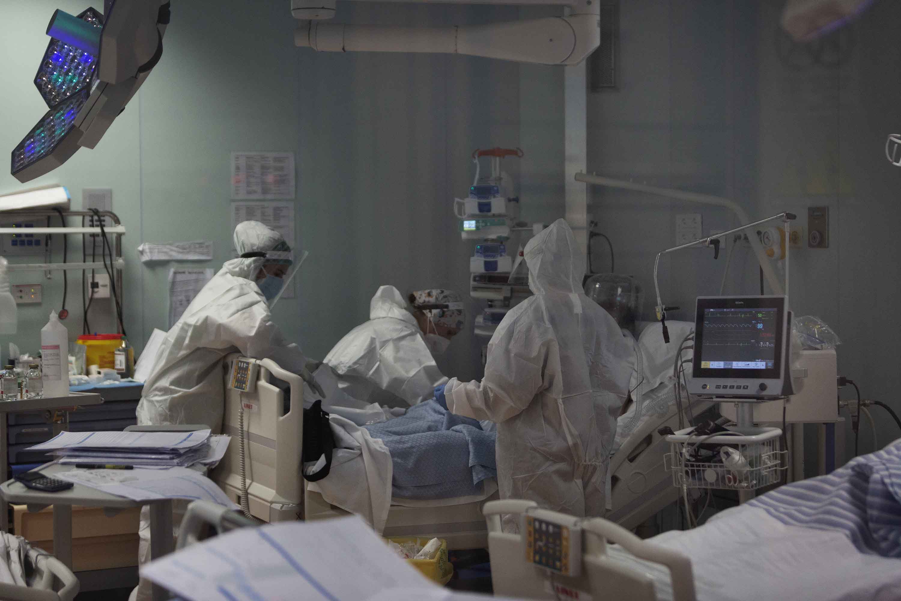 Doctors and nurses treat a patient inside the intensive care unit of a hospital in Rome, Italy on November 6.