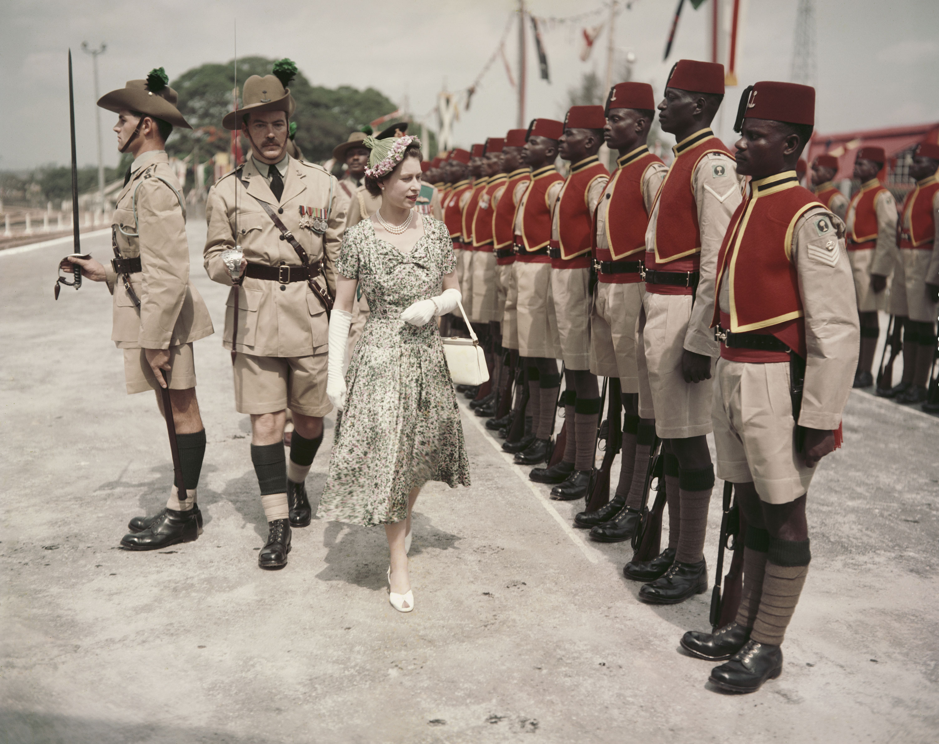 Queen Elizabeth inspects men of the Queen's Own Nigeria Regiment, Royal West African Frontier Force, at Kaduna Airport in Nigeria during her Commonwealth tour in 1956.