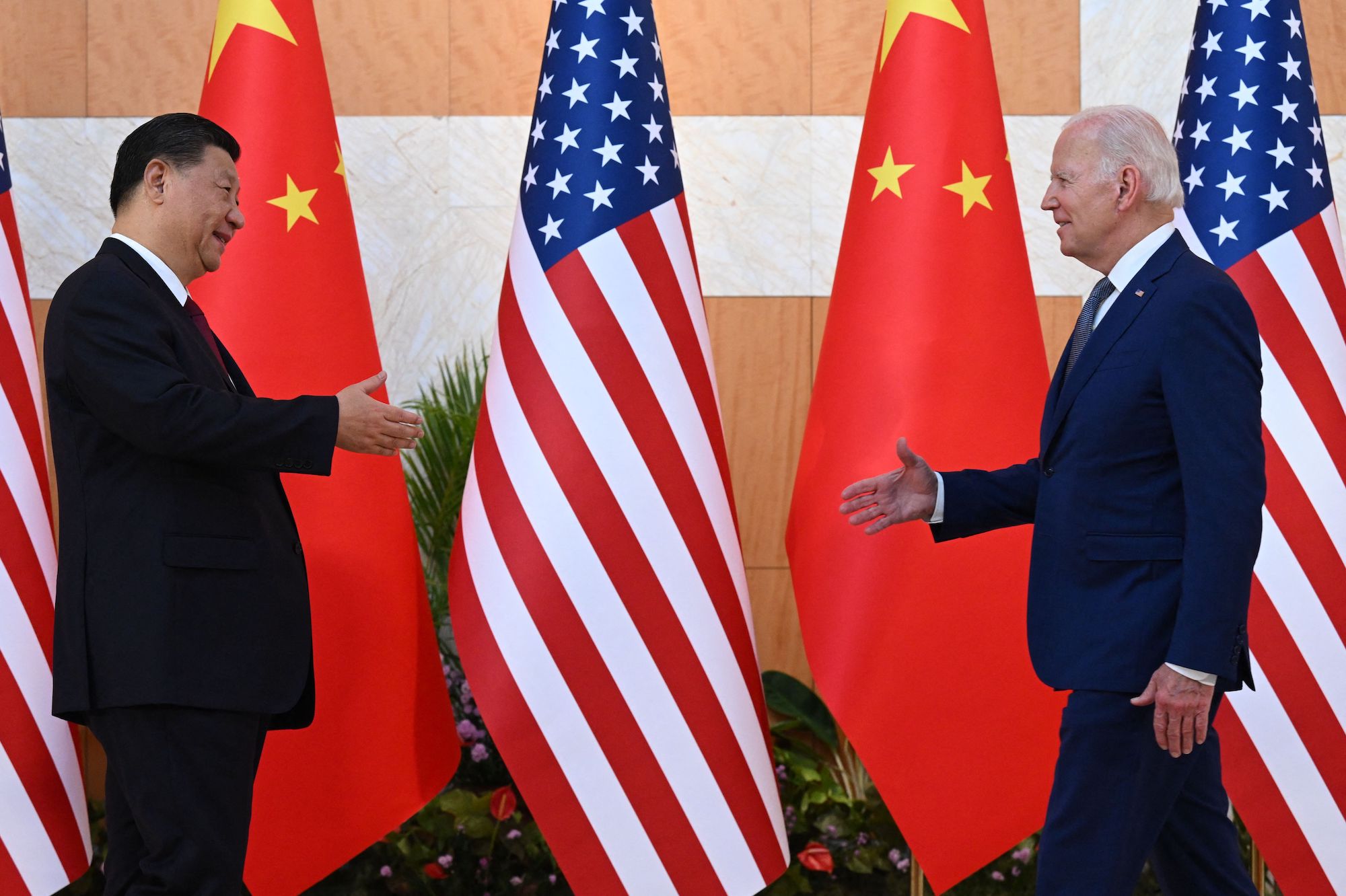 Joe Biden and Xi Jinping shake hands at the G20 Summit in Bali on November 14, 2022.