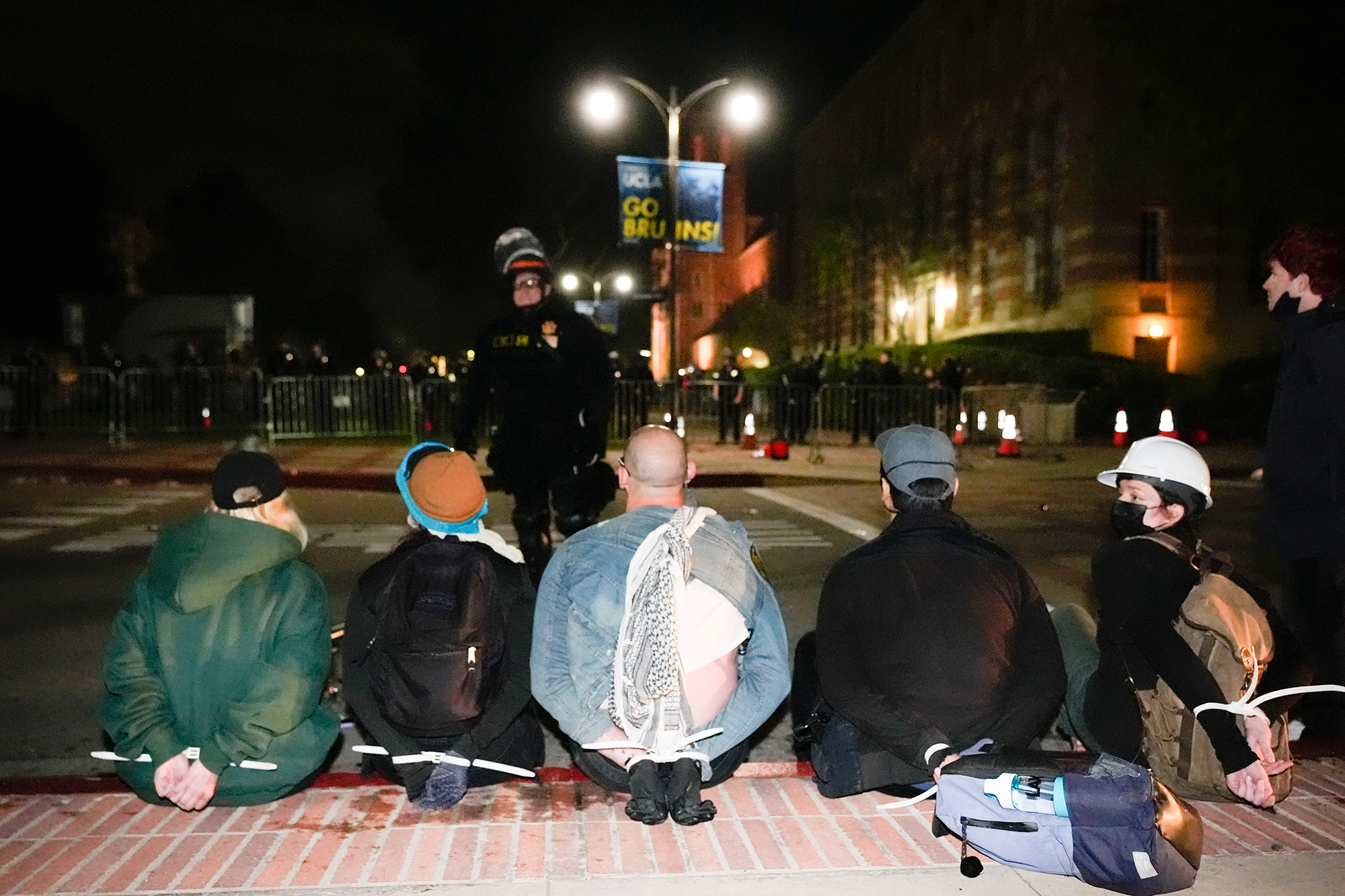 Demonstrators are detained on the UCLA campus on Thursday, May 2. 