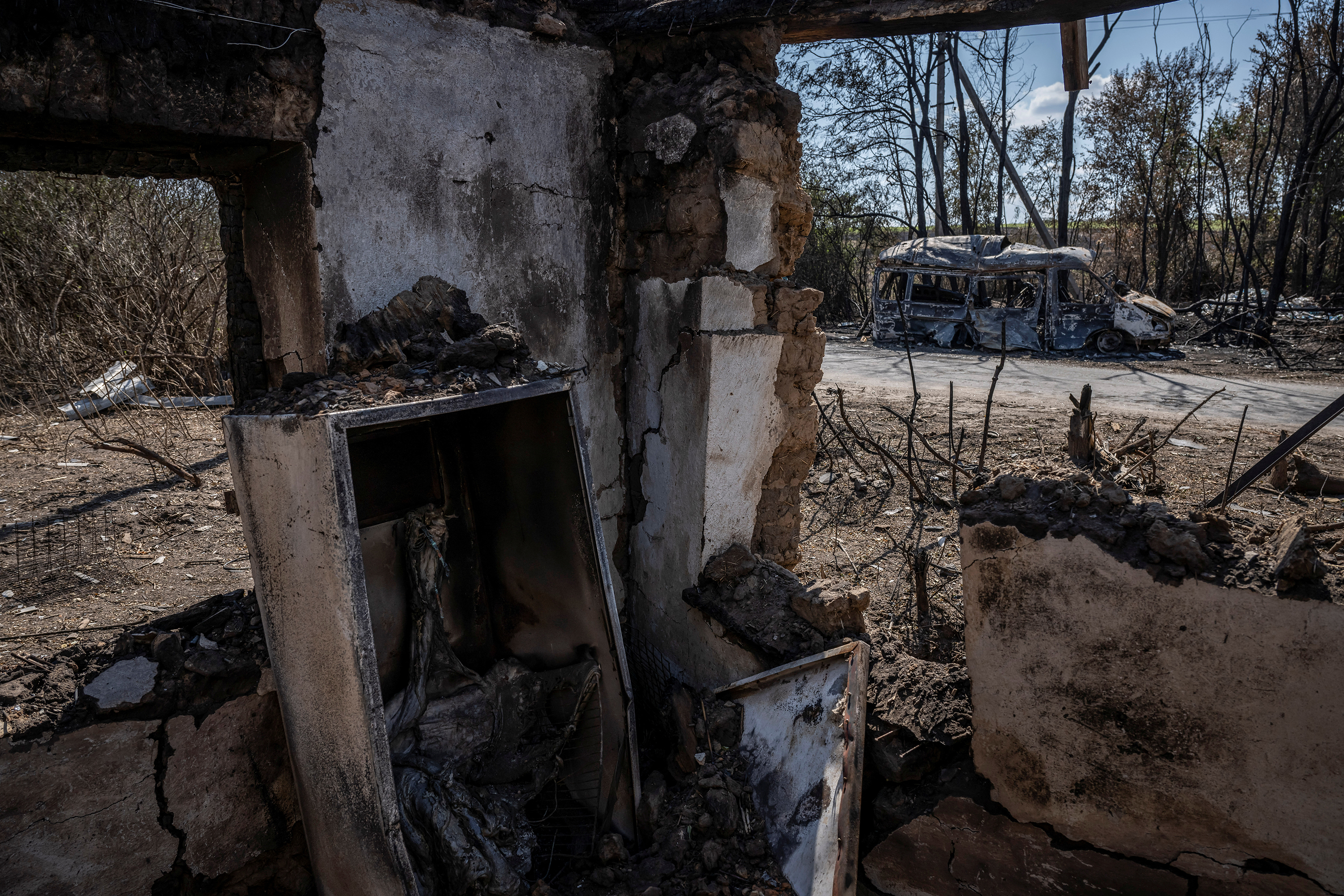 A destroyed car is seen from a destroyed building near the village of Robotyne, Zaporizhzhia region, Ukraine, on August 25.