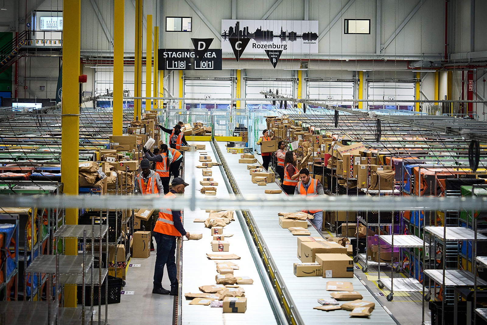 Employees work at an Amazon delivery station in Rozenburg, Netherlands, on November 30, 2022.