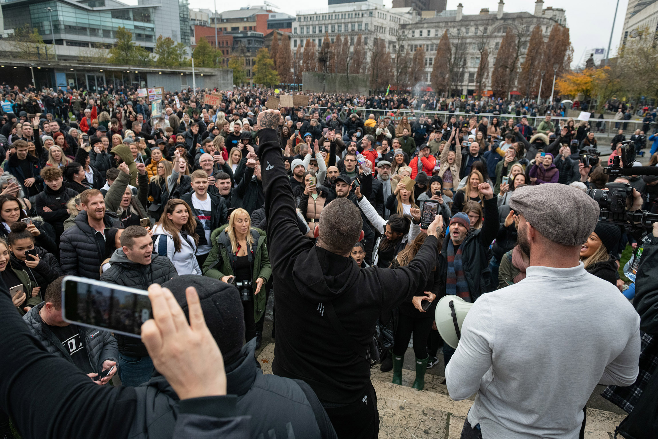 Protesters gather at St Peters Square during an anti-lockdown protest in Manchester, England on Sunday, November 8. 