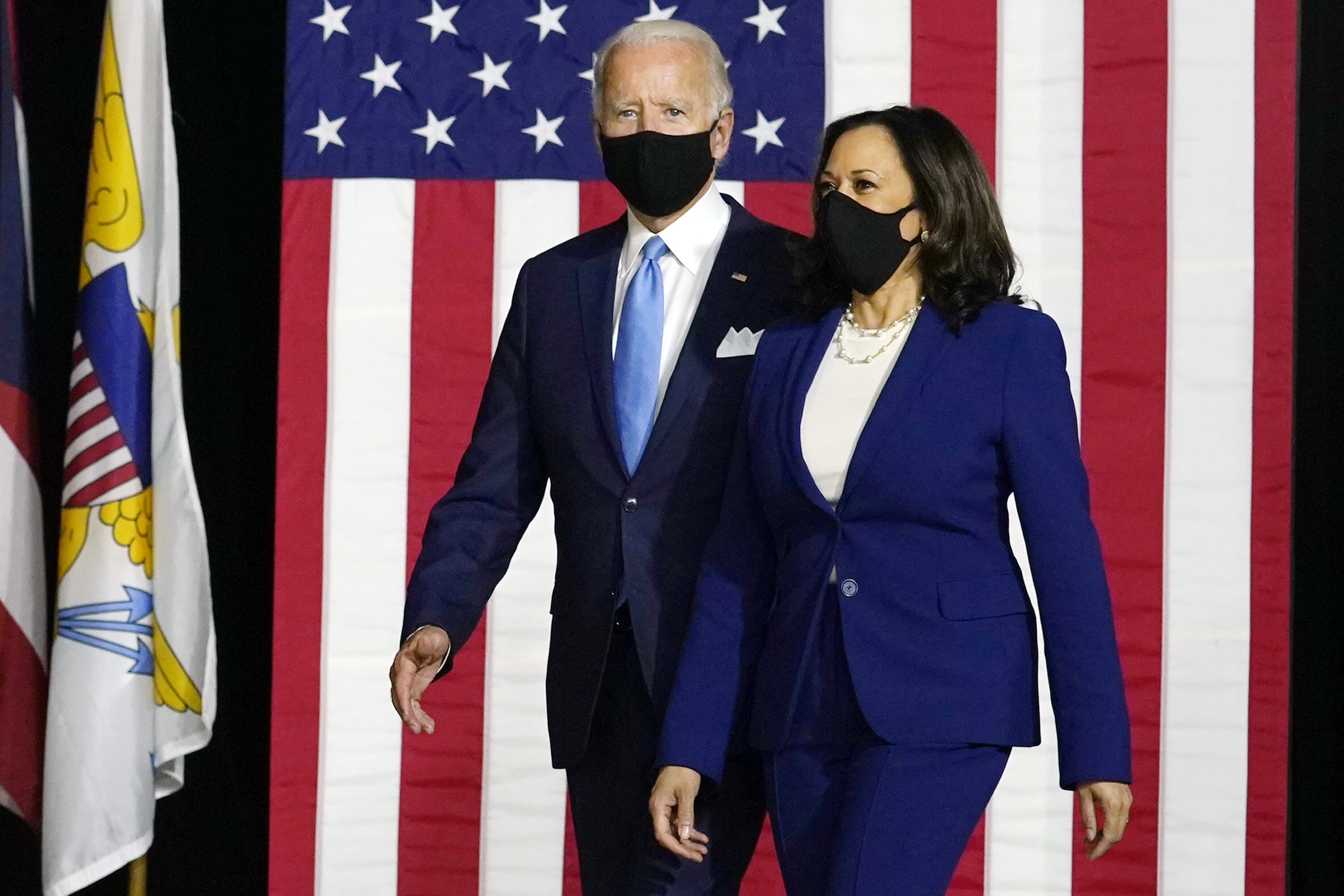 Joe Biden and Kamala Harris arrive to speak at a news conference on August 12 in Wilmington, Delaware. 