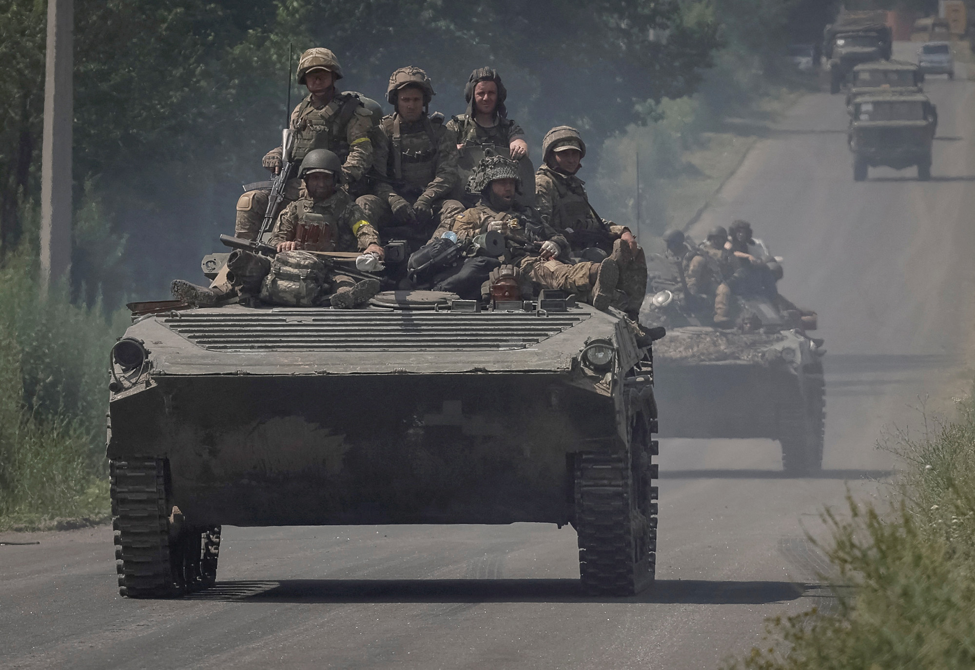 Ukrainian servicemen ride BMP-1 infantry fighting vehicle in the Donetsk region, Ukraine, on June 14.