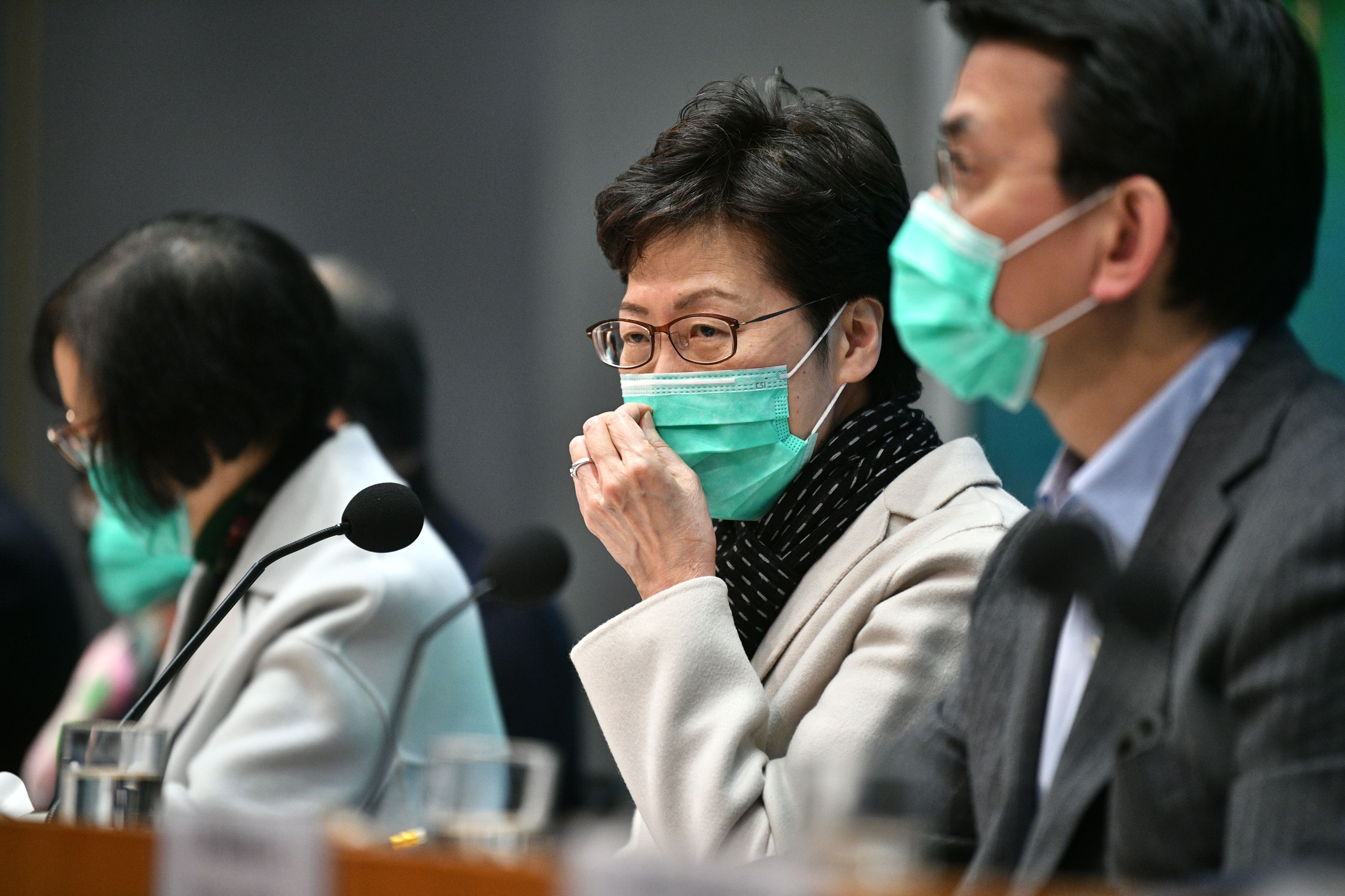 Hong Kong's Chief Executive Carrie Lam said the city will reduce cross-border travel between the mainland in an effort to control the spread of the Wuhan coronavirus.