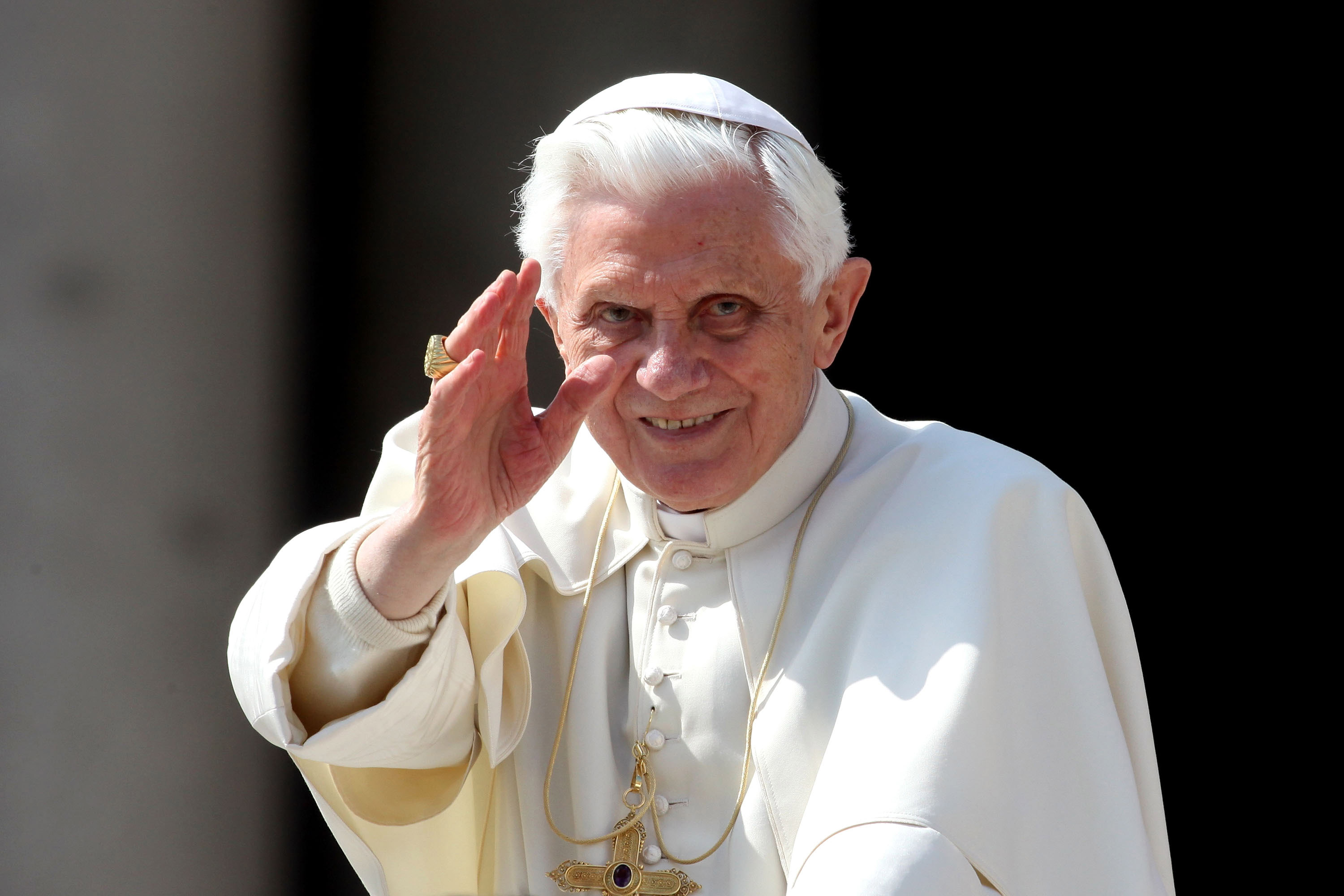 Pope Benedict XVI waves to the faithful gathered in St. Peter's Square during his weekly audience on March 30, 2011, in the Vatican City.