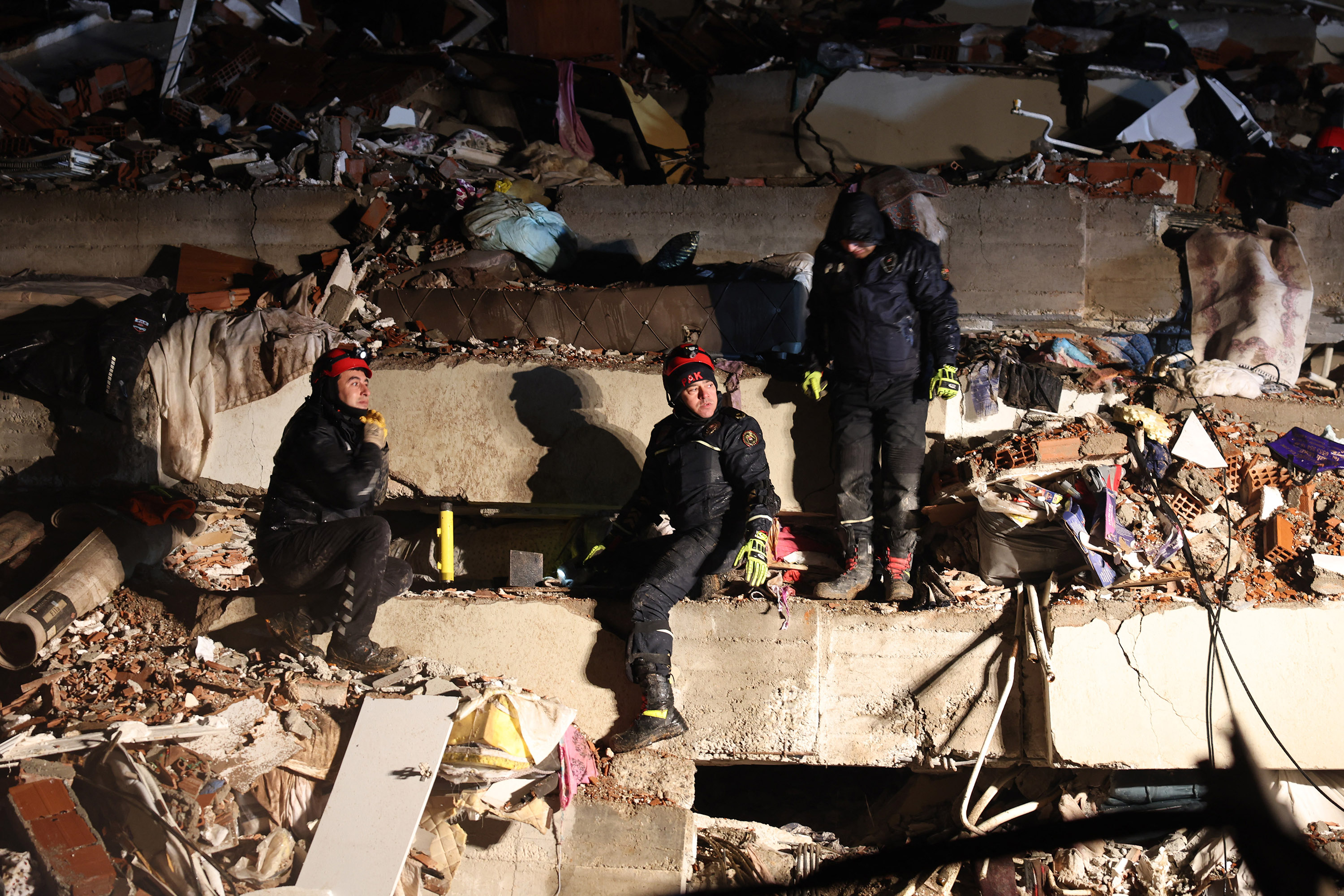 Rescuers search for victims and survivors amidst the rubble of collapsed buildings in Kahramanmaras, Turkey, on February 7.