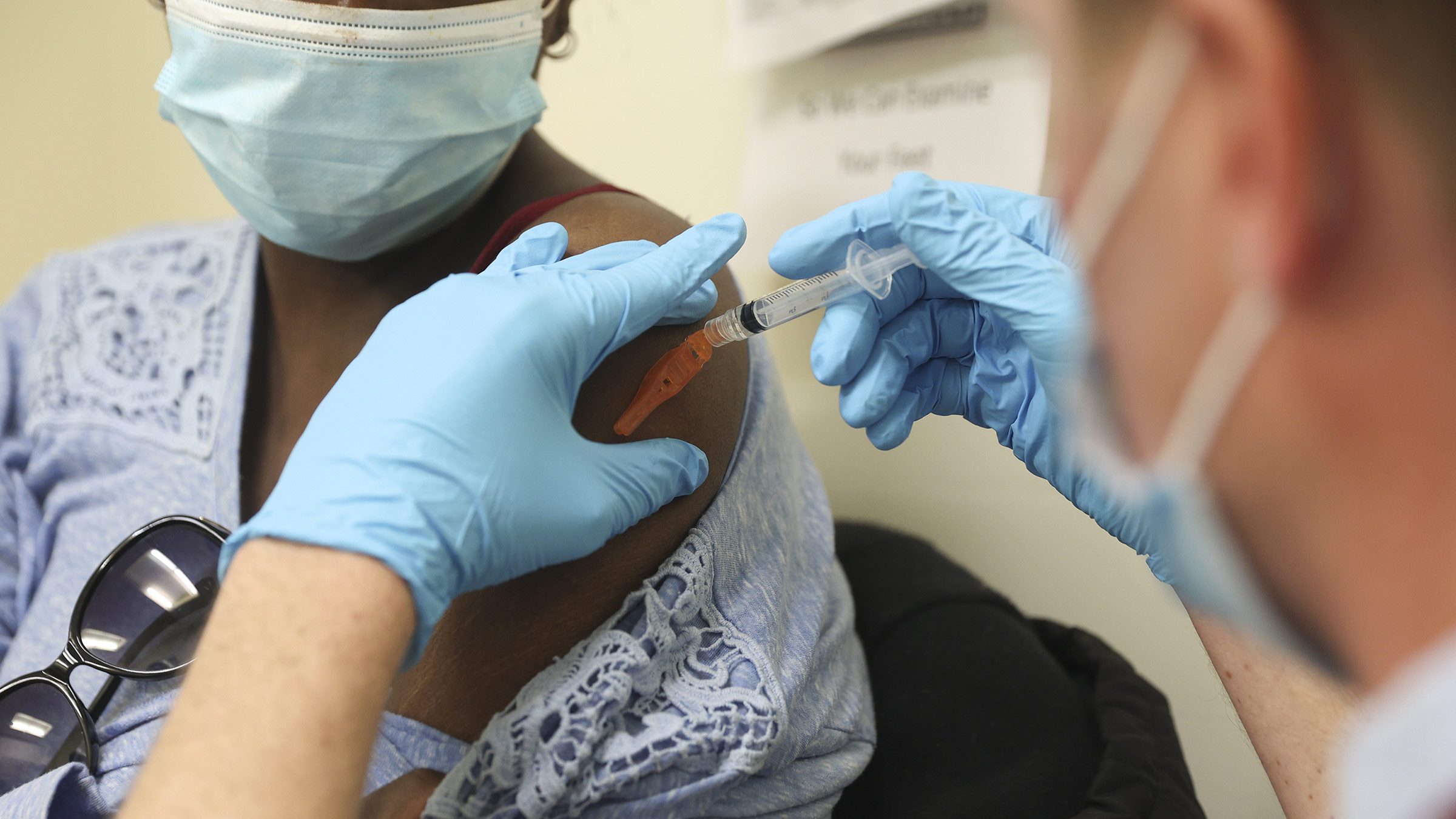 A health worker administers a Covid-19 vaccine at a shelter in New York, on March 25.