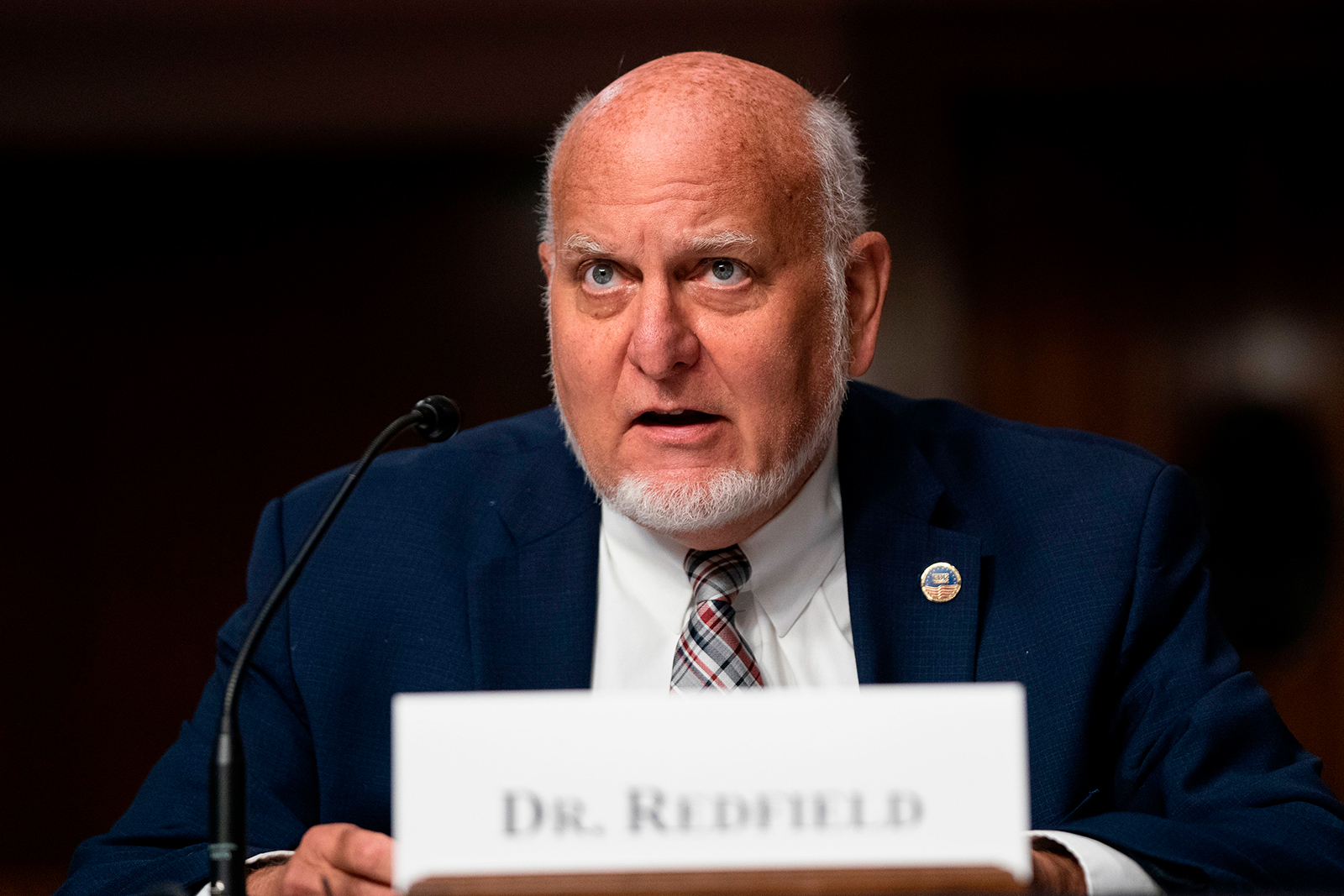 Dr. Robert Redfield, director of the US Centers for Disease Control and Prevention, testifies during a US Senate Senate Health, Education, Labor, and Pensions Committee hearing on Wednesday.