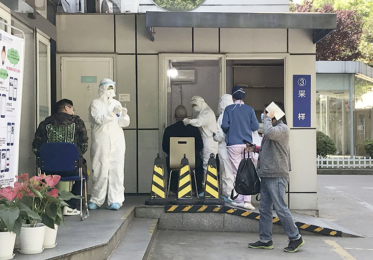 A PCR test for the new coronavirus is carried out at a general hospital in Shanghai on April 28. 