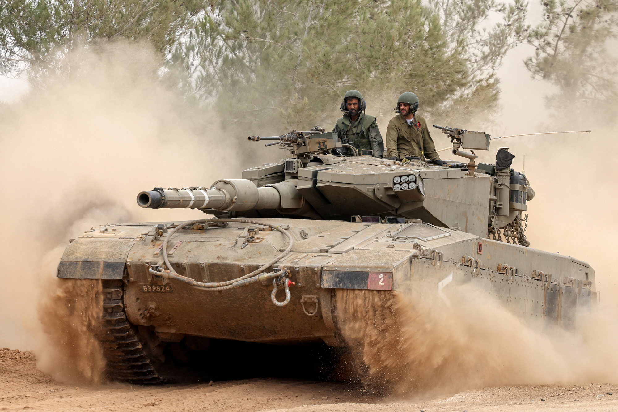 An Israeli military tank rolls near the border with Gaza on December 5.