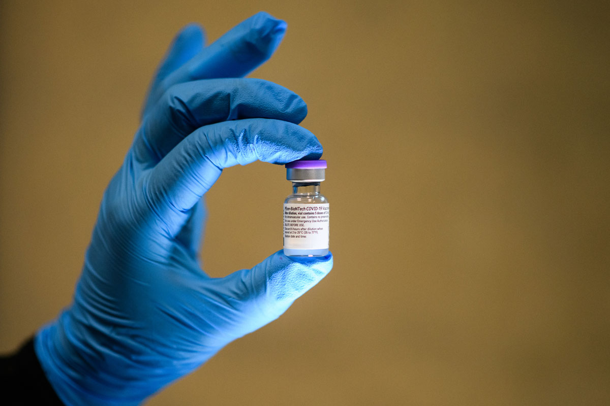 A vial of the Pfizer/BioNTech Covid-19 vaccine is seen during a vaccination clinic at the Sir Ludwig Guttmann Health and Wellbeing Centre on December 15 in Stratford, England.