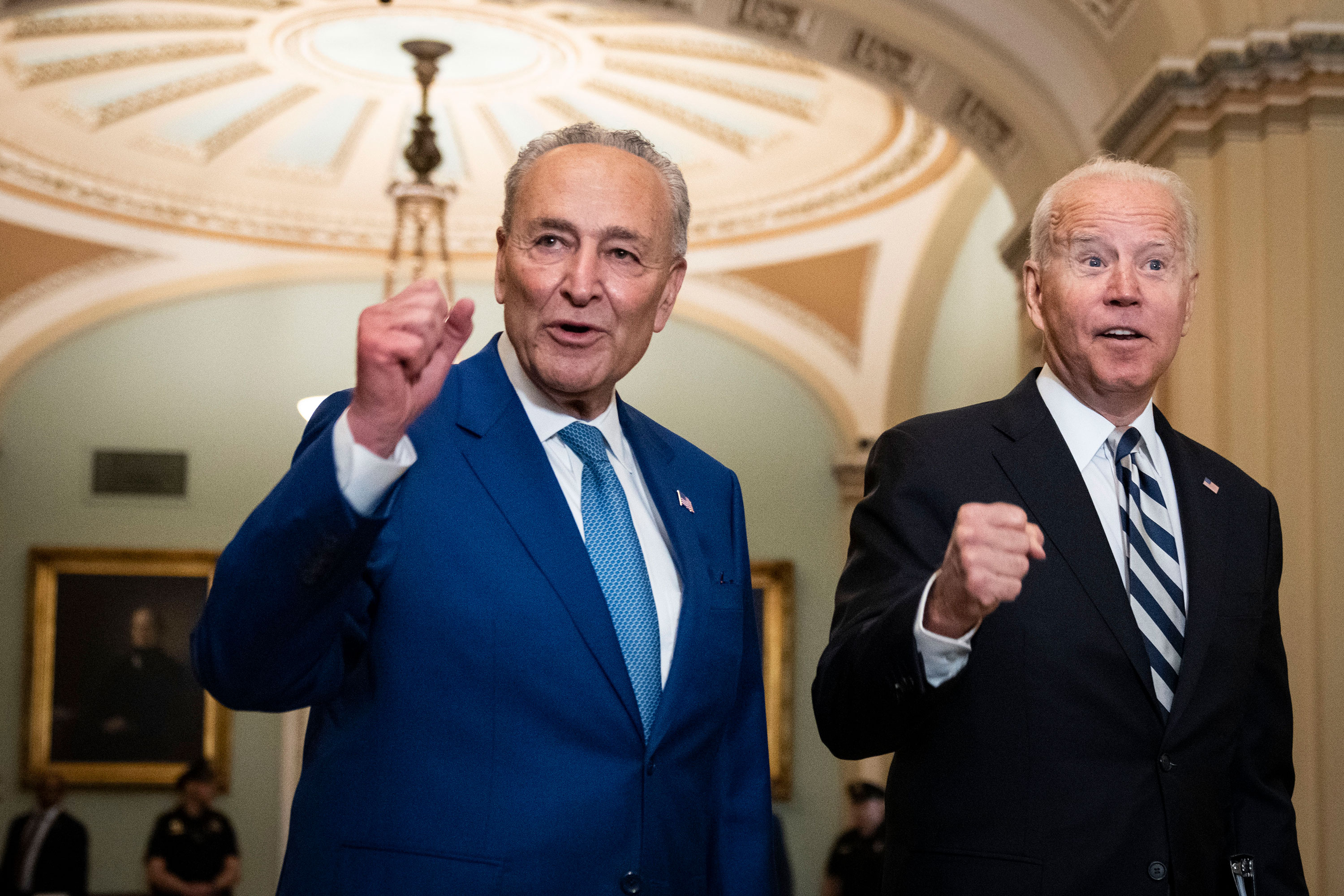 Senate Majority Leader Chuck Schumer and President Joe Biden speak briefly to reporters as they arrive at the US Capitol in July 2021.