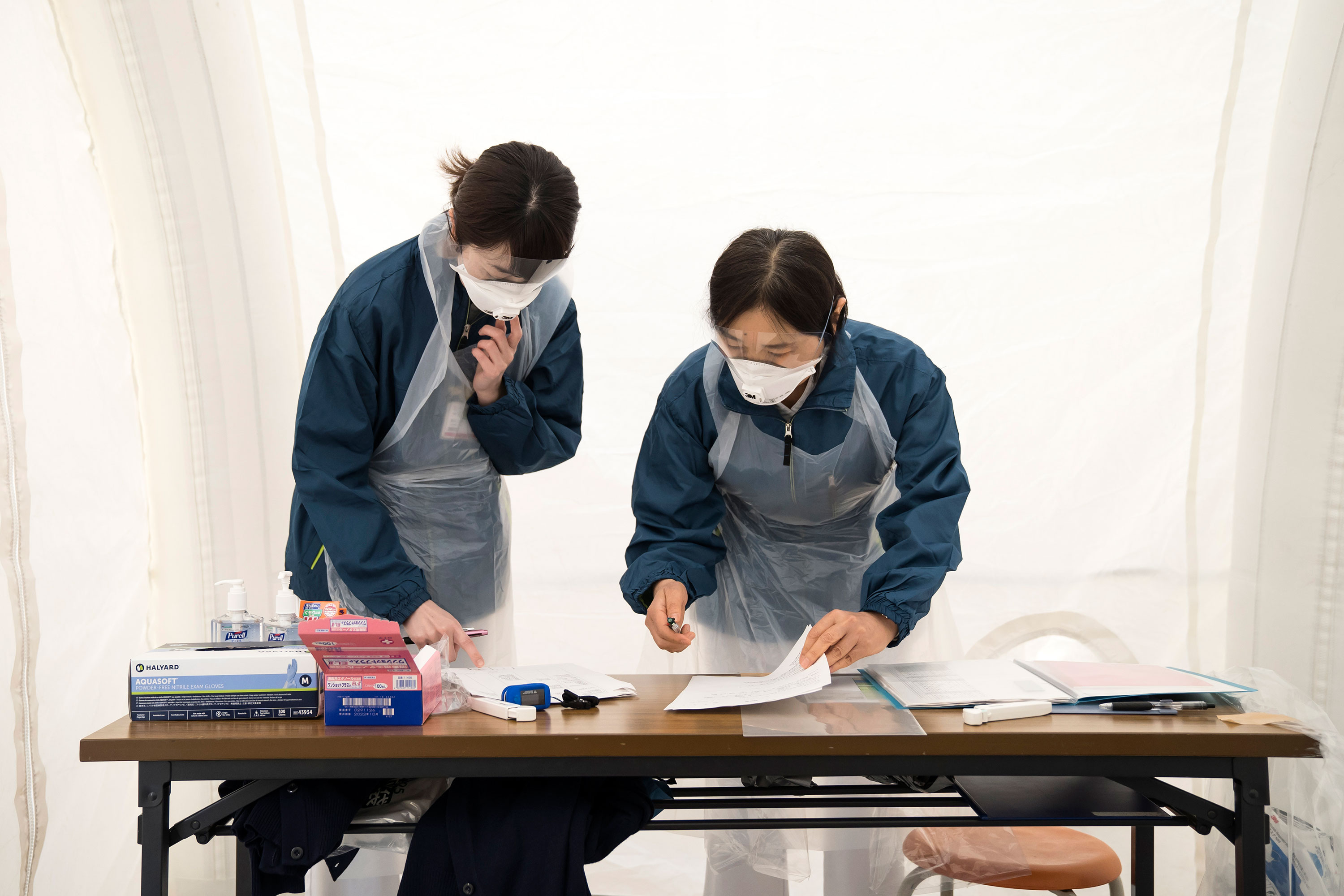 Medical staff prepare to screen potential coronavirus patients at Kawakita General Hospital on April 17, in Tokyo, Japan.
