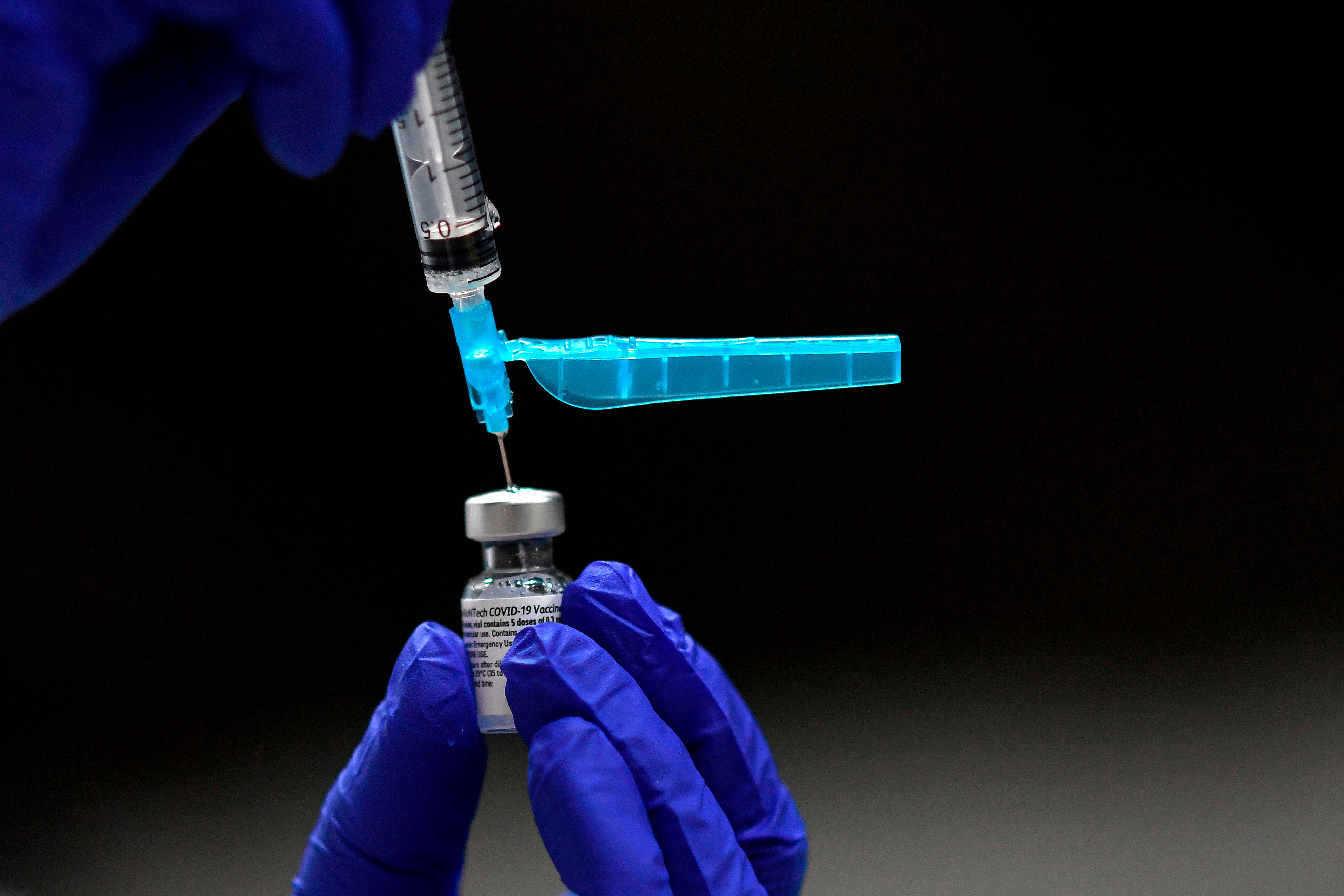 A health worker prepares the Pfizer/BioNTech Covid-19 vaccine in Madrid on January 12.