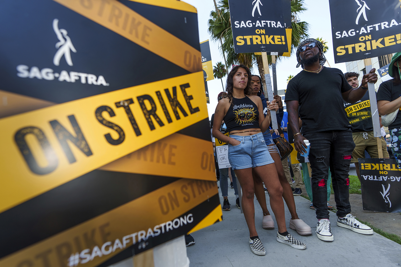SAG-AFTRA actors walk on a picket line outside Netflix studios on September 26 in Los Angeles. 