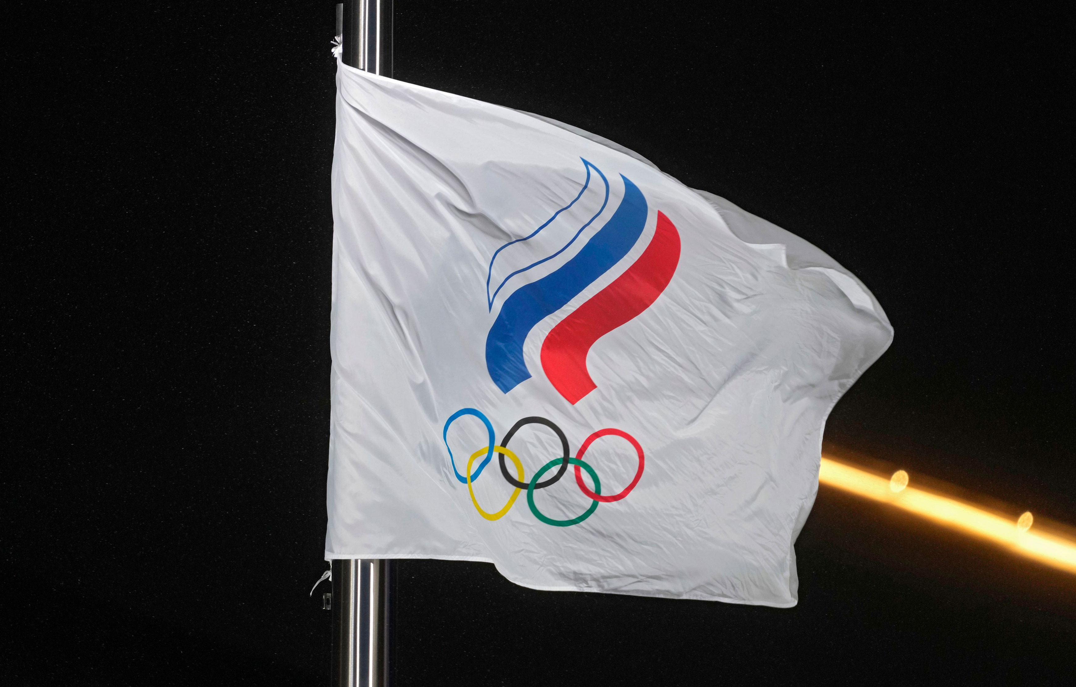 The flag of the Russian Olympic Committee flies during an award ceremony on Feb. 13.