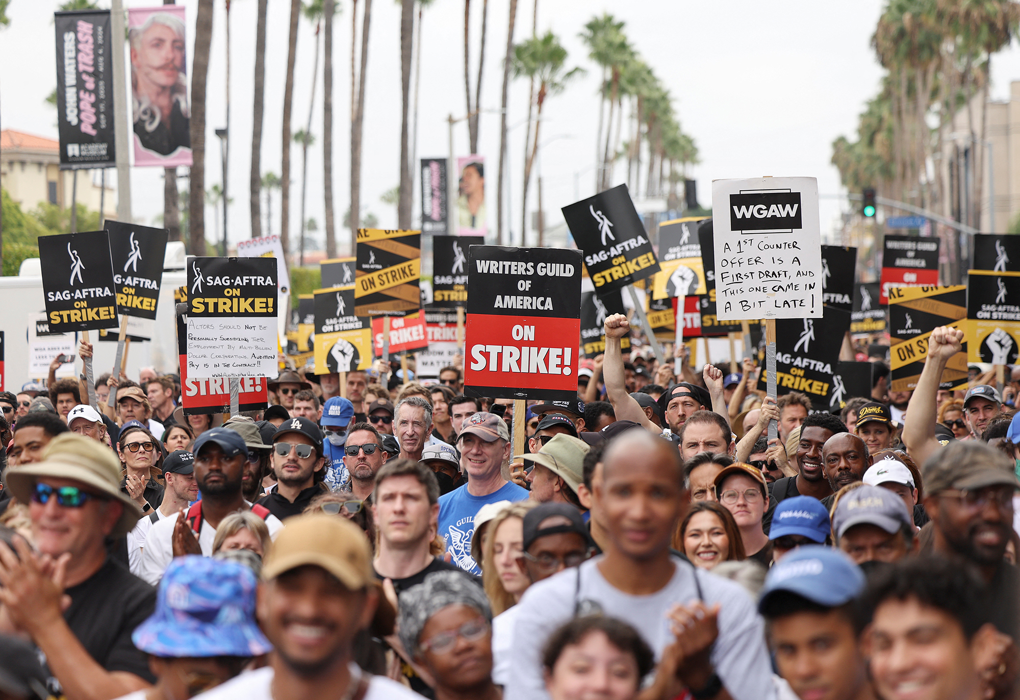 Members of SAG-AFTRA and the Writers Guild of America picket in Los Angeles, California, on September 13. 