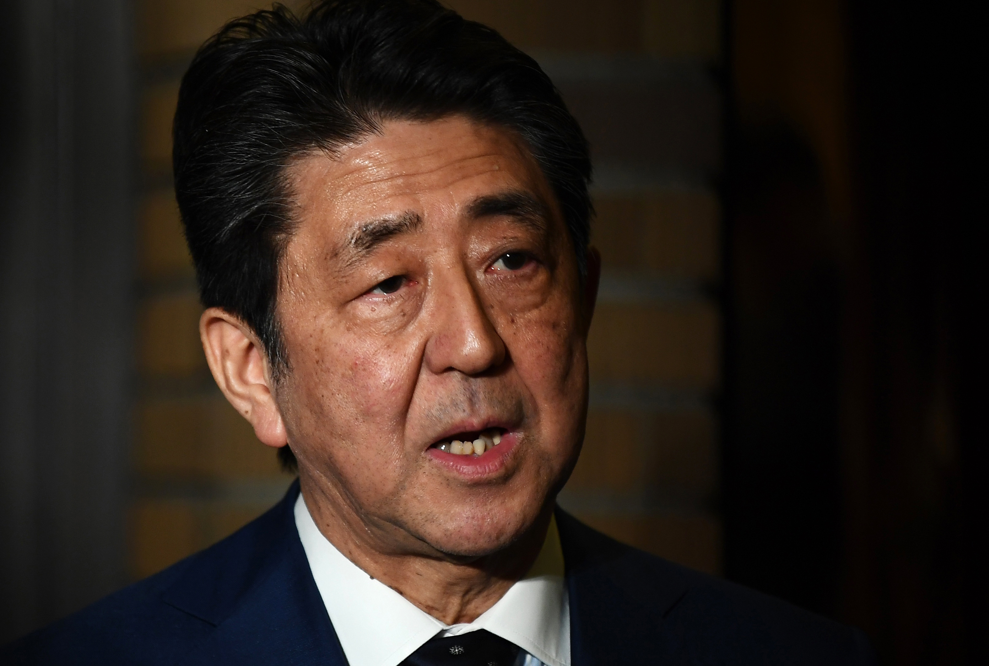 Japanese Prime Minister Shinzo Abe speaks to the press in Tokyo on Tuesday, March 24.