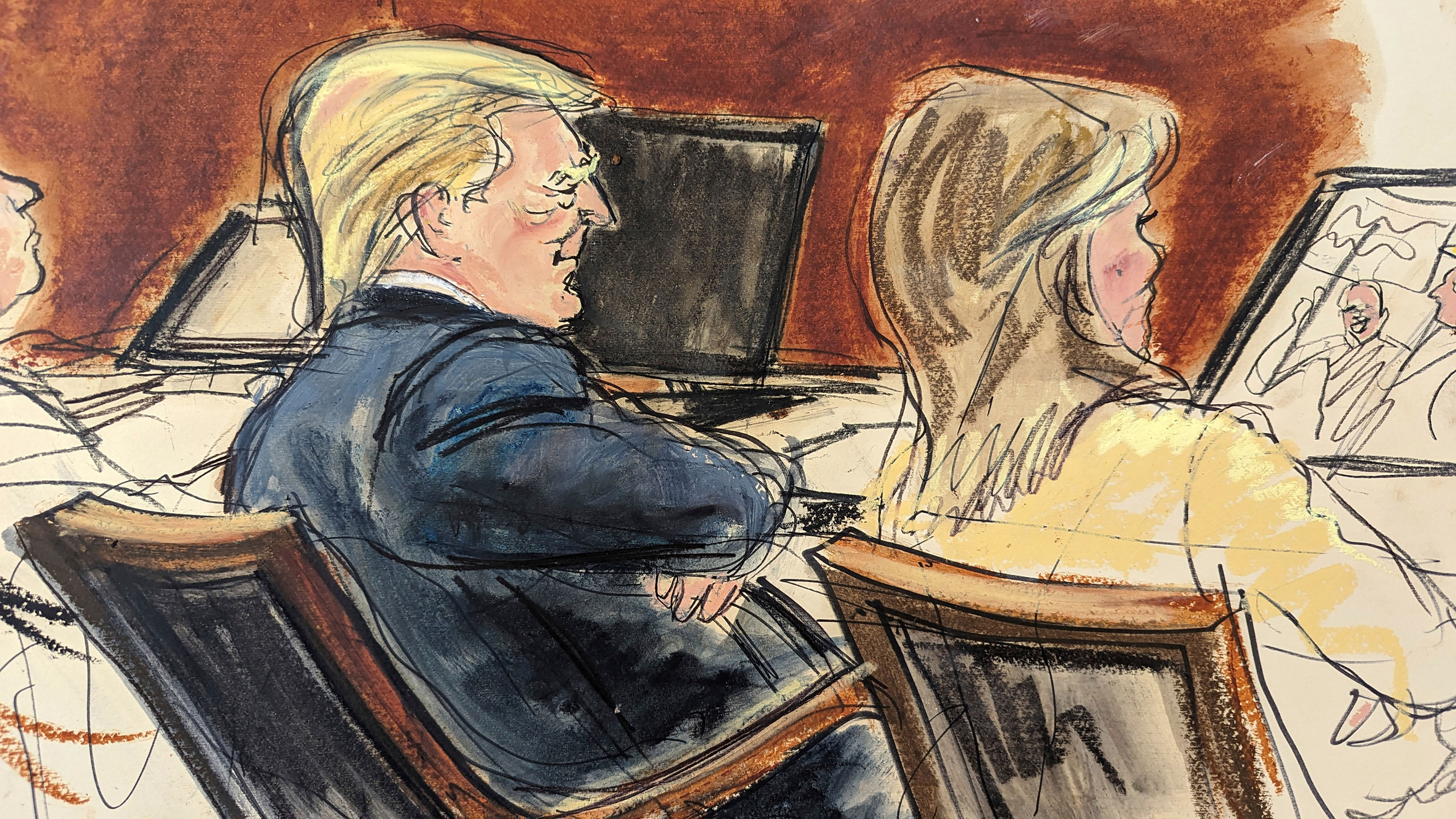 Former President Donald Trump sits with arms folded beside his attorney Alina Habba in the Manhattan Federal Court on Wednesday.