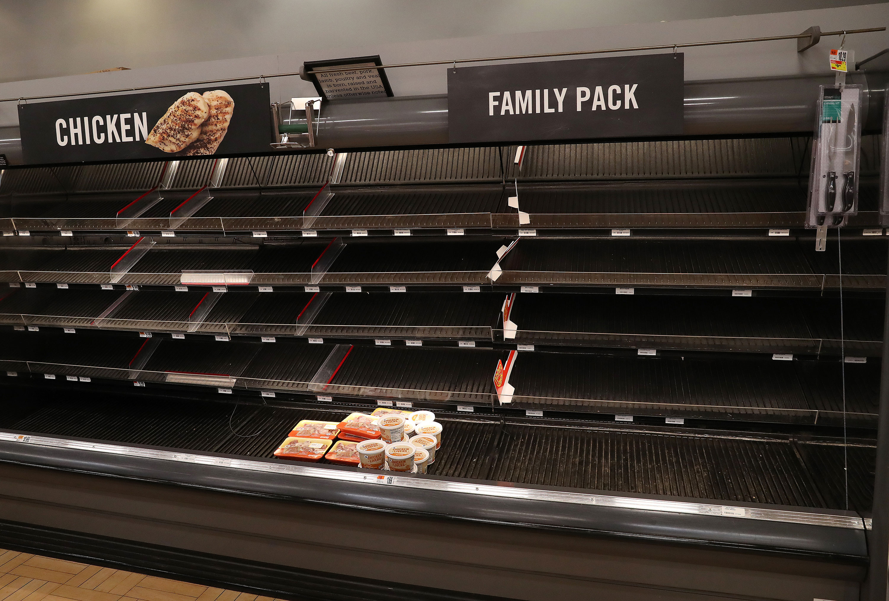 Empty shelves at a supermarket in Dunkirk, Maryland, is seen on March 13.