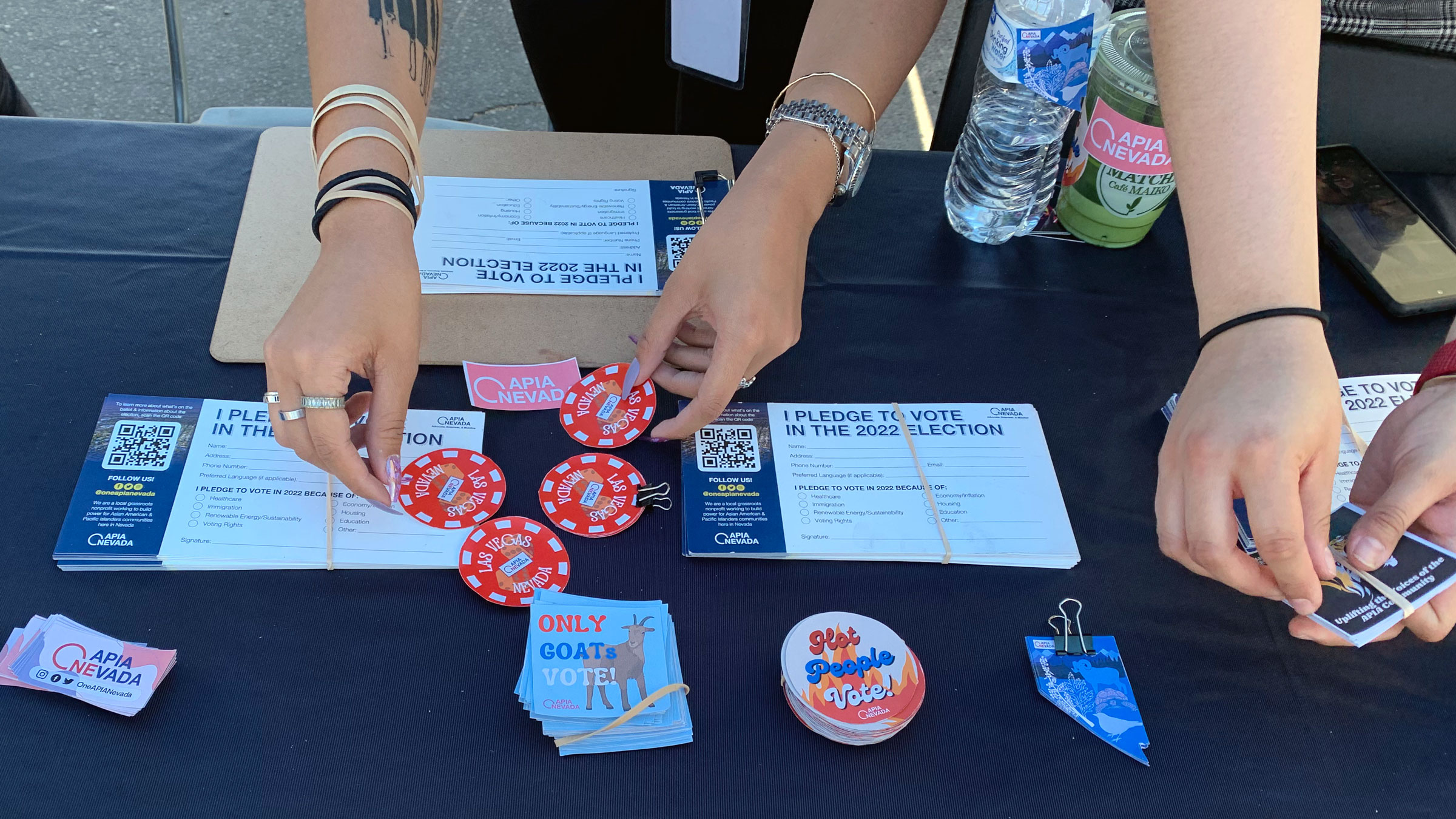 Voting stickers are handed out in Las Vegas at an event trying to mobilize Asian and Pacific Islander voters.
