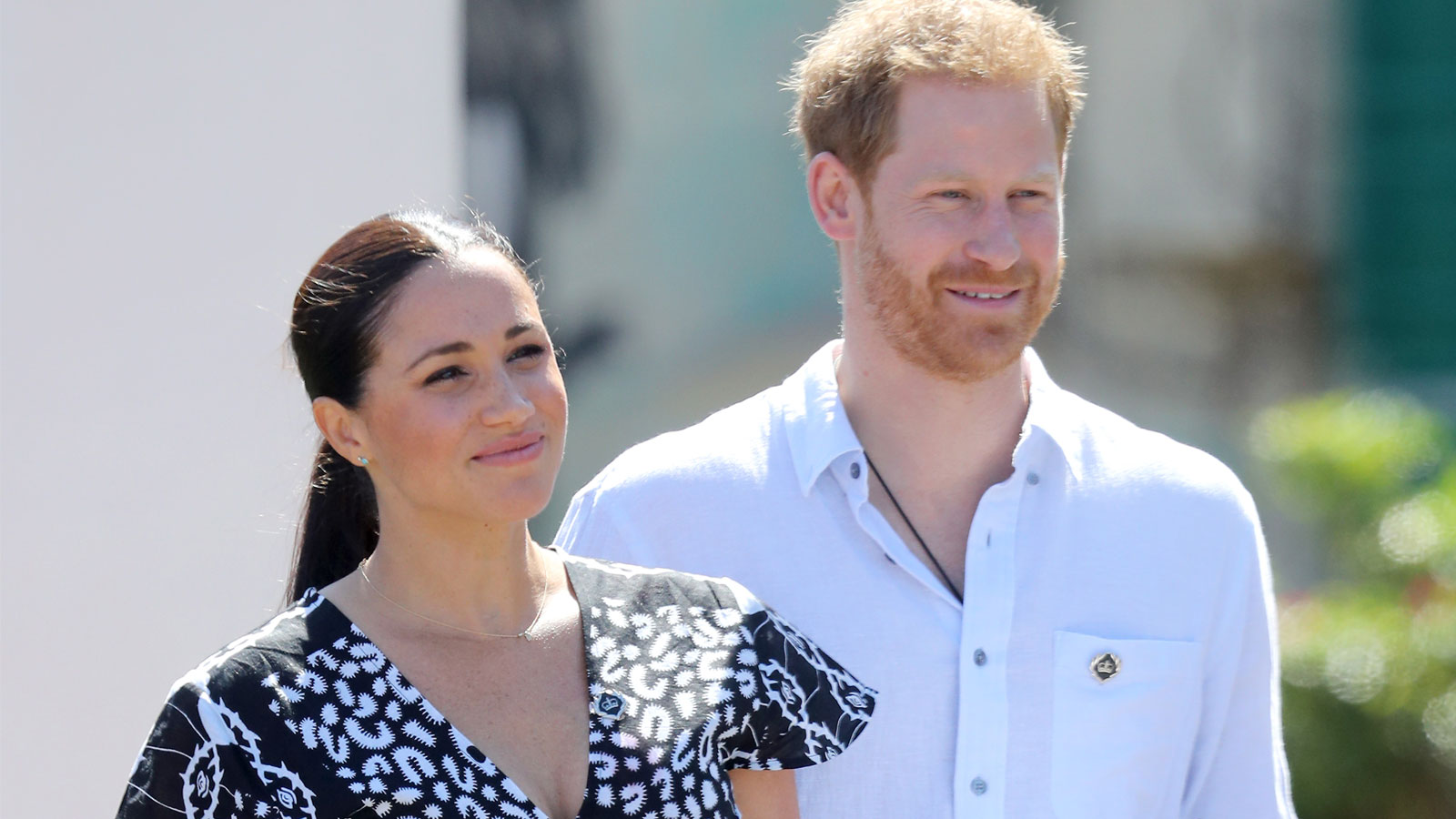 Meghan and Harry smile as they visit a Justice Desk initiative in Nyanga township, during their royal tour of South Africa on Monday. 