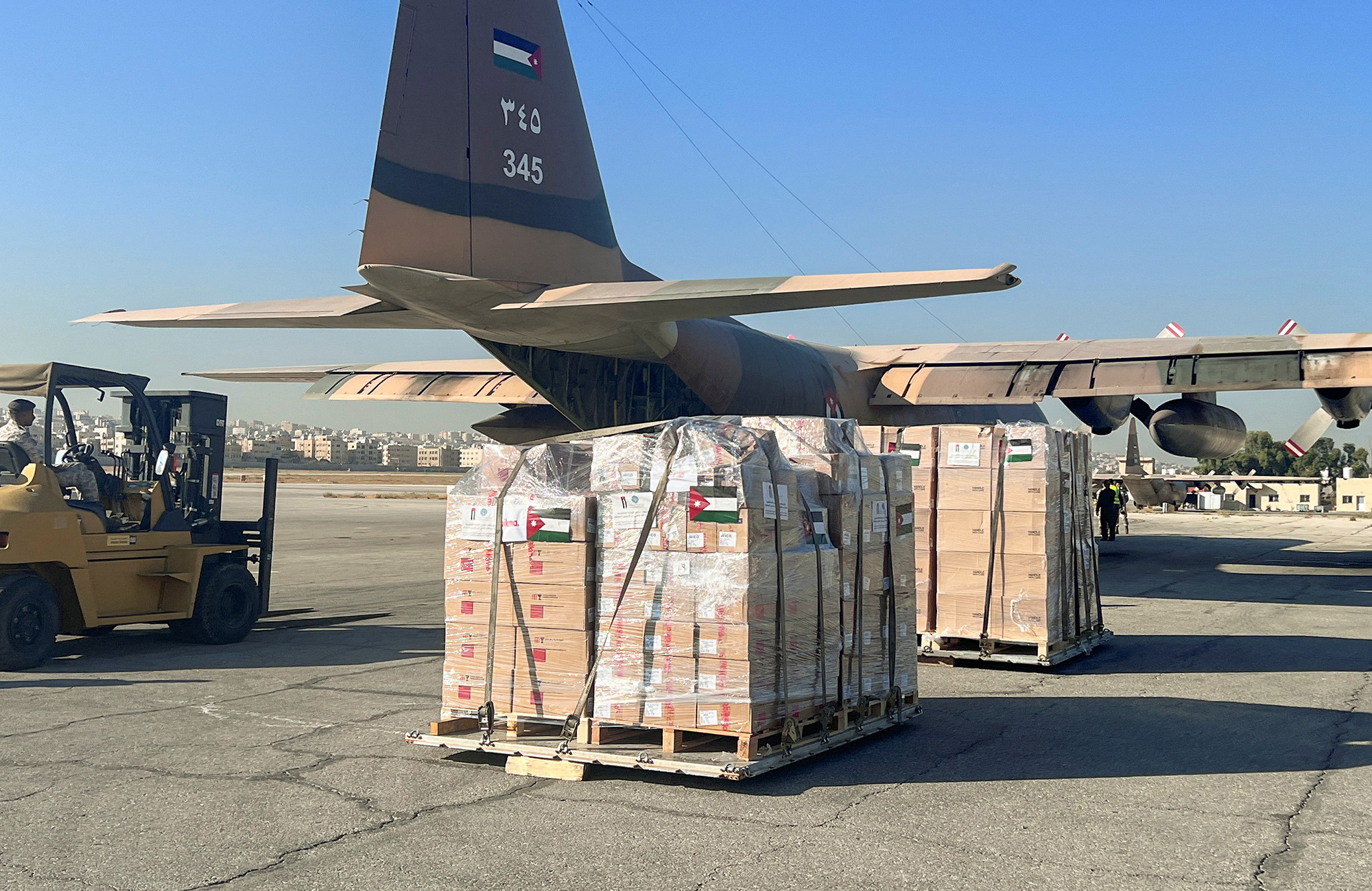 Humanitarian aid and supplies from Jordan Hashemite Charity Organization are loaded inside a military airplane destined for Gaza, in Amman, Jordan, on October 12.