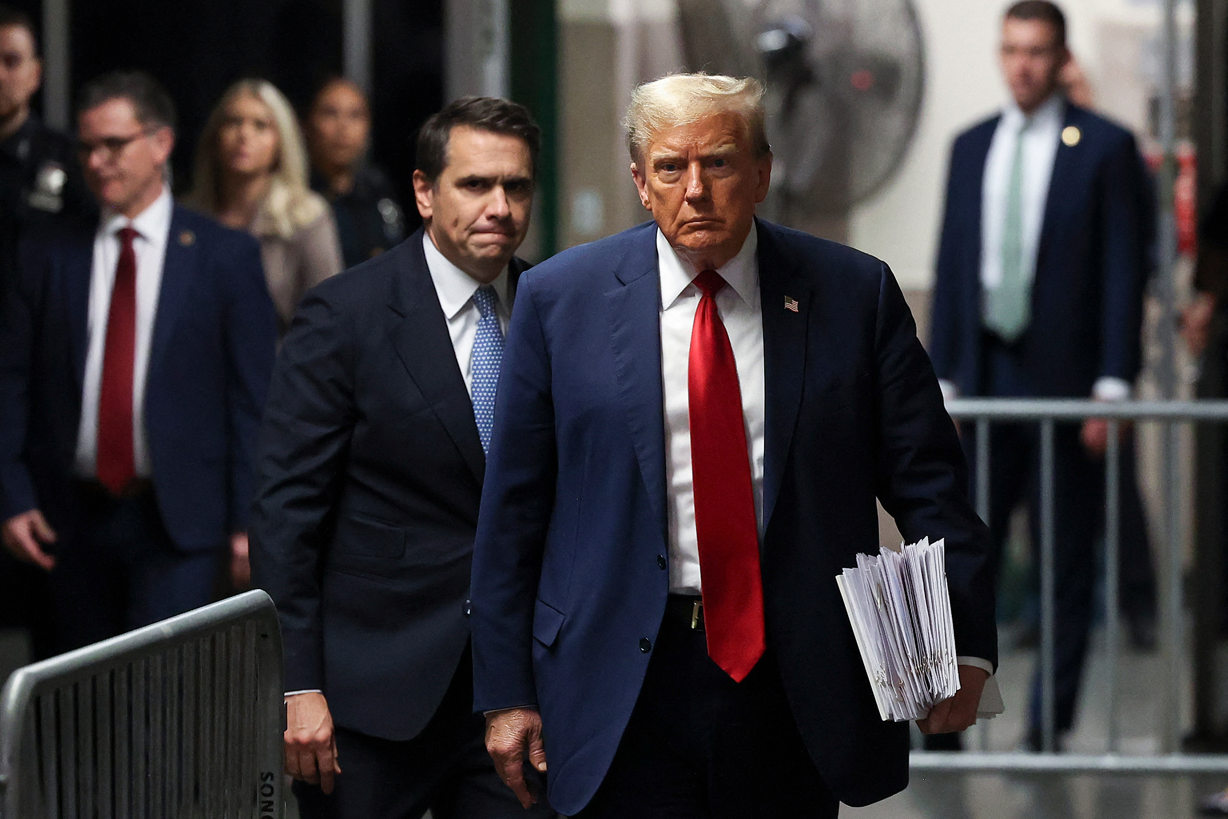 Former President Donald Trump, with attorney Todd Blanche, walks toward the press to speak at Manhattan Criminal Court in New York City on April 23.