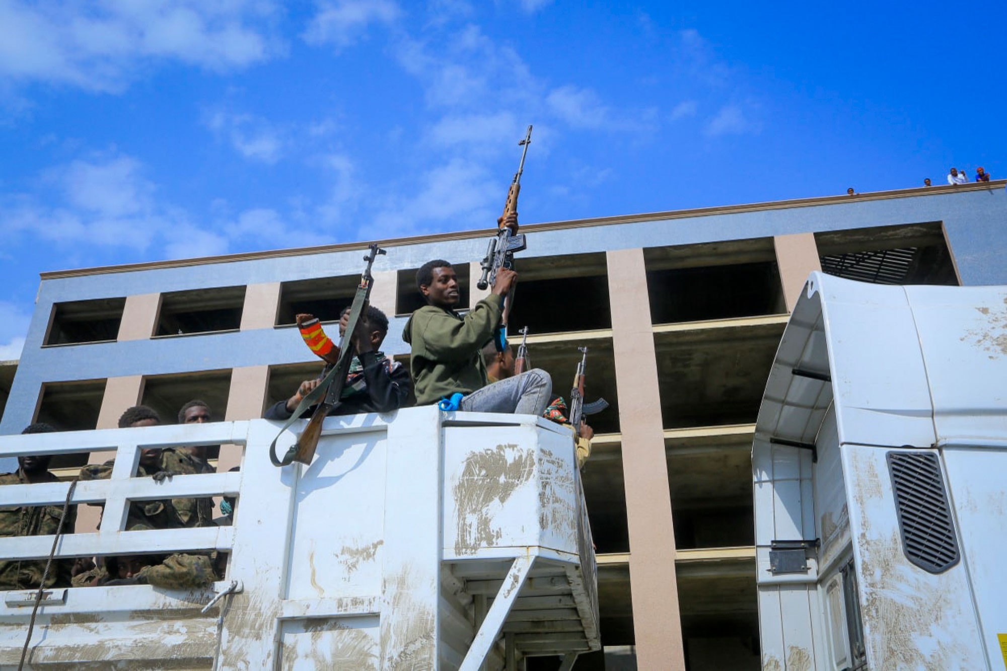 Tigrayan forces parade captured Ethiopian government soldiers and allied militia members in open-top trucks, as they are taken to a detention center in Mekelle, in the Tigray region of Ethiopia, on October 22.