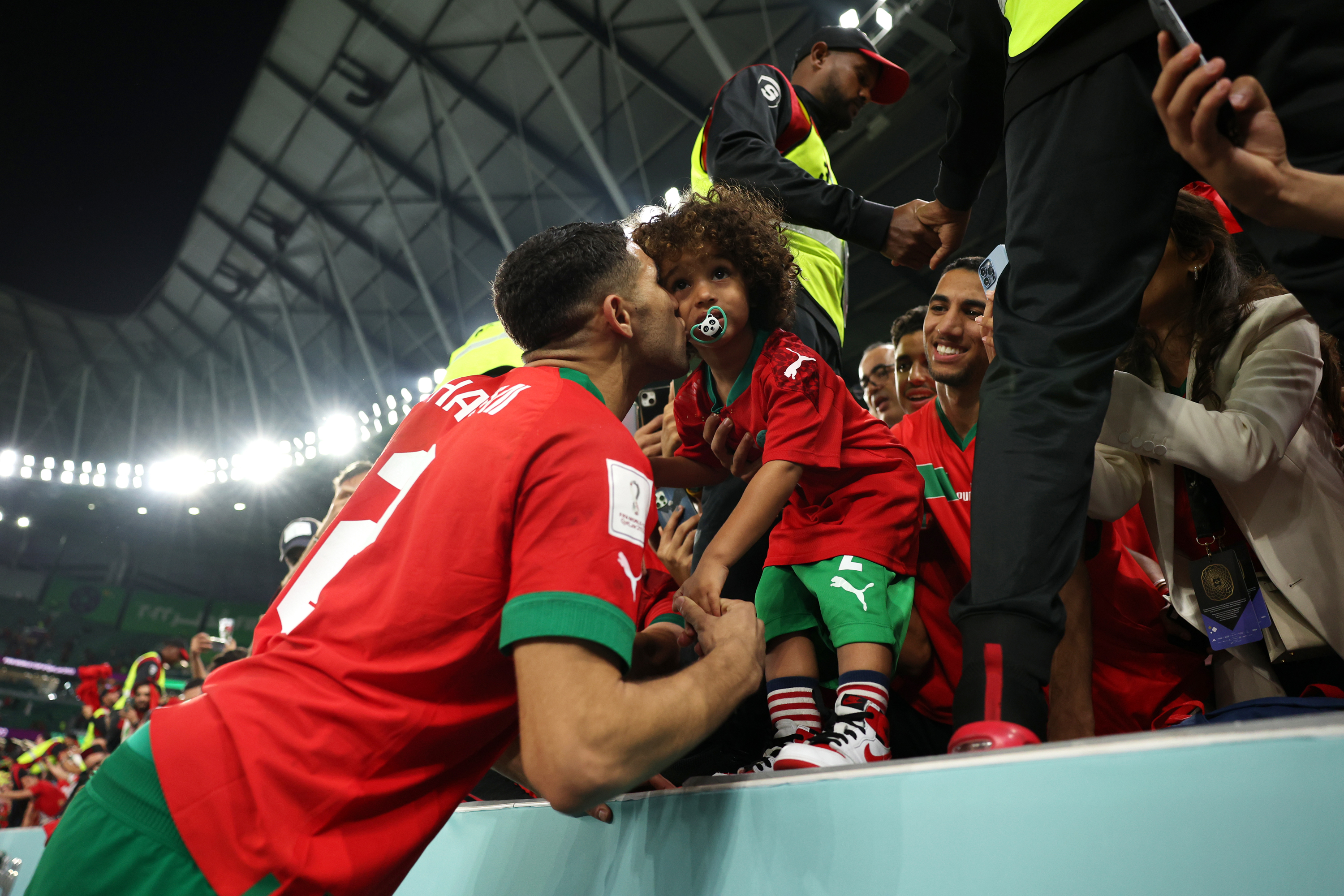 Achraf Hakimi of Morocco celebrates with family members after defeating Spain at Education City Stadium in Al Rayyan, Qatar on December 6.