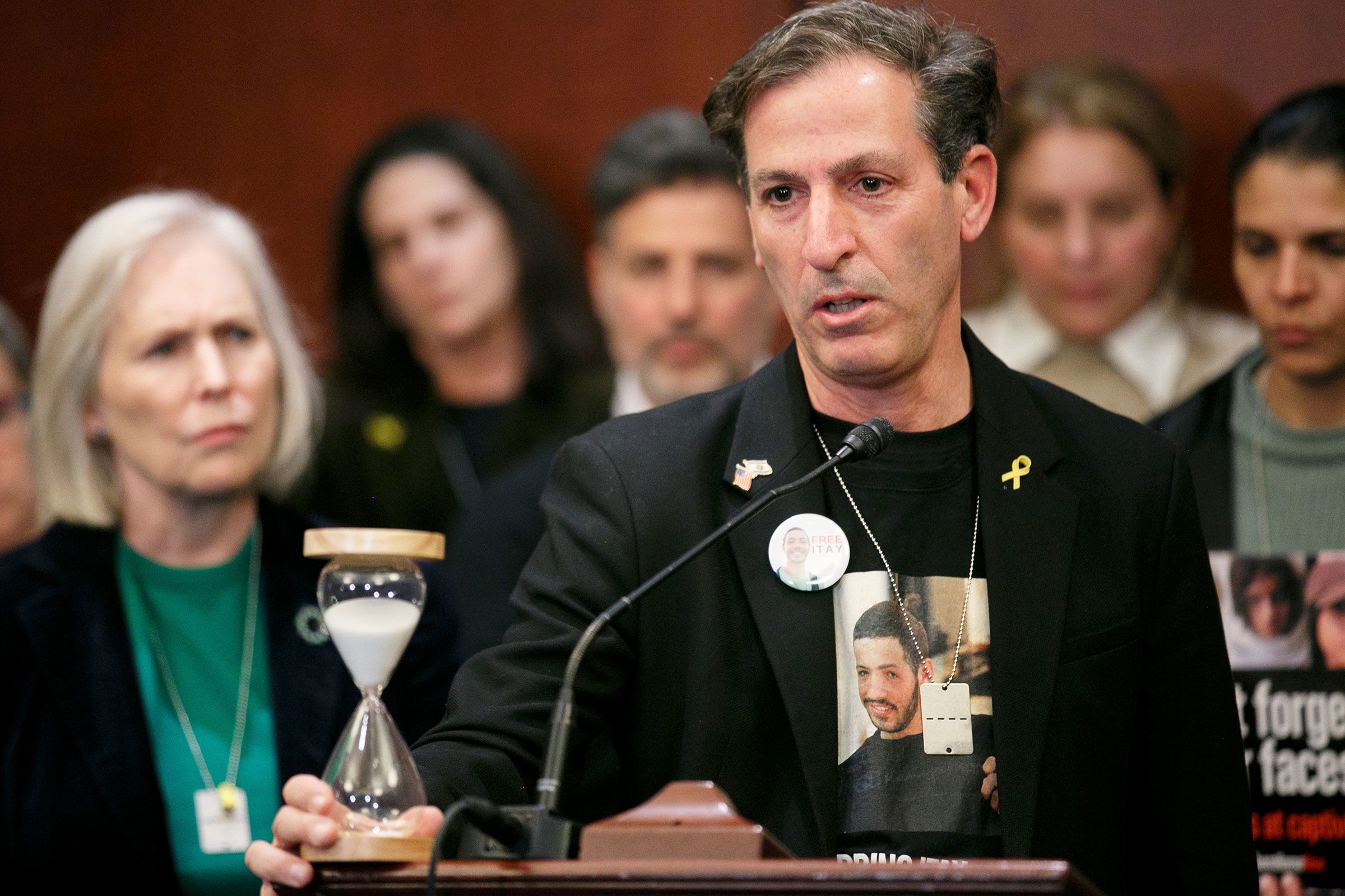 Ruby Chen, father of Itay Chen, who is being held hostage by Hamas, holds an hourglass while speaking a Senate Foreign Relations Committee bipartisan press conference at the US Capitol in Washington, DC, on January 17.
