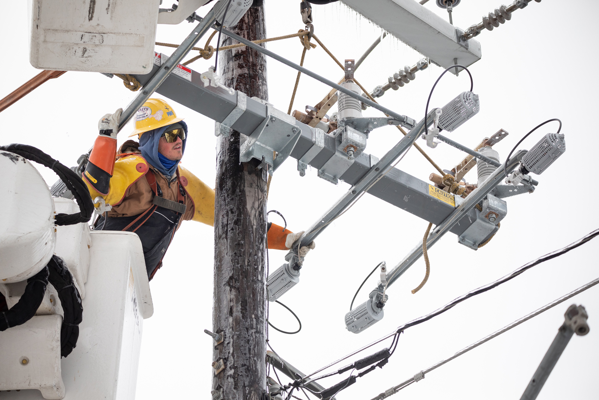 A worker repairs a power line in Austin, Texas, on February 18.