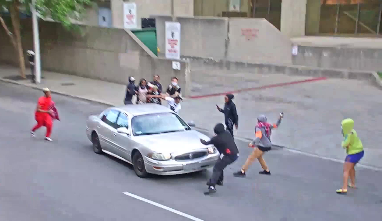 Protesters engage with a car in Louisville, Kentucky. 