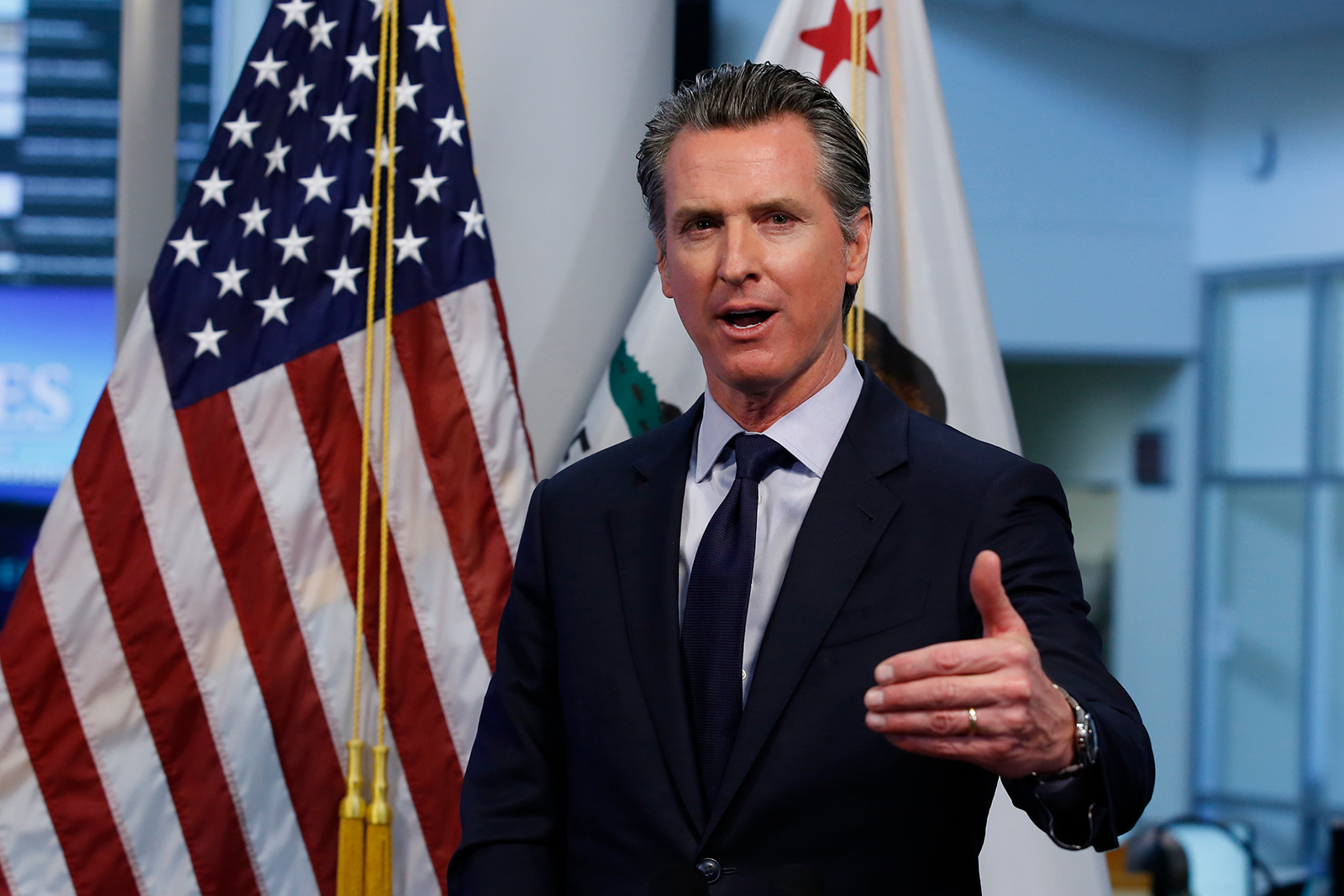 Gov. Gavin Newsom discusses an outline for what it will take to lift coronavirus restrictions during a news conference in Rancho Cordova, California on April 14.