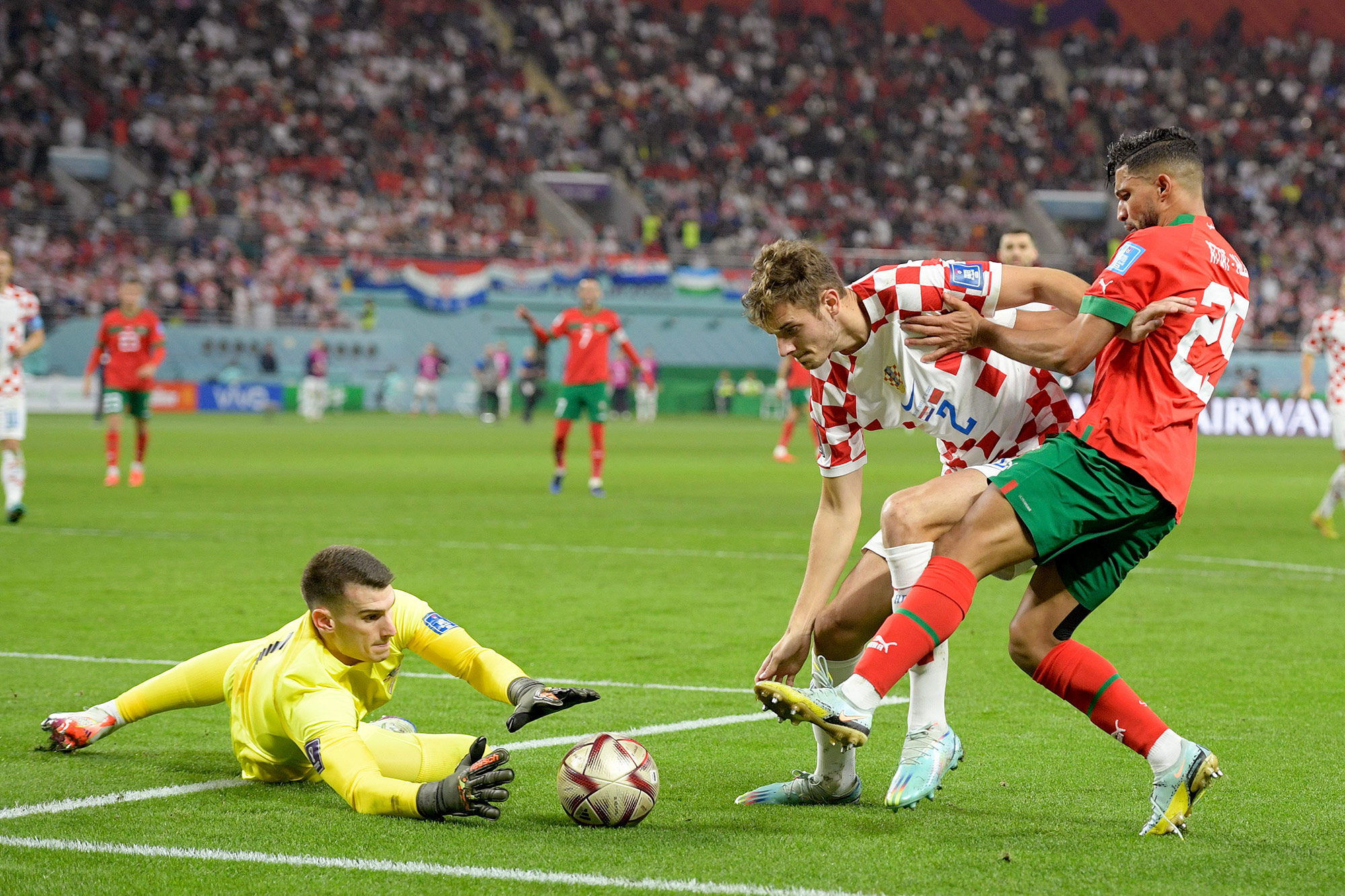 Croatia’s goalkeeper Dominik Livakovic dives for the ball during the match against Morocco on Saturday. 