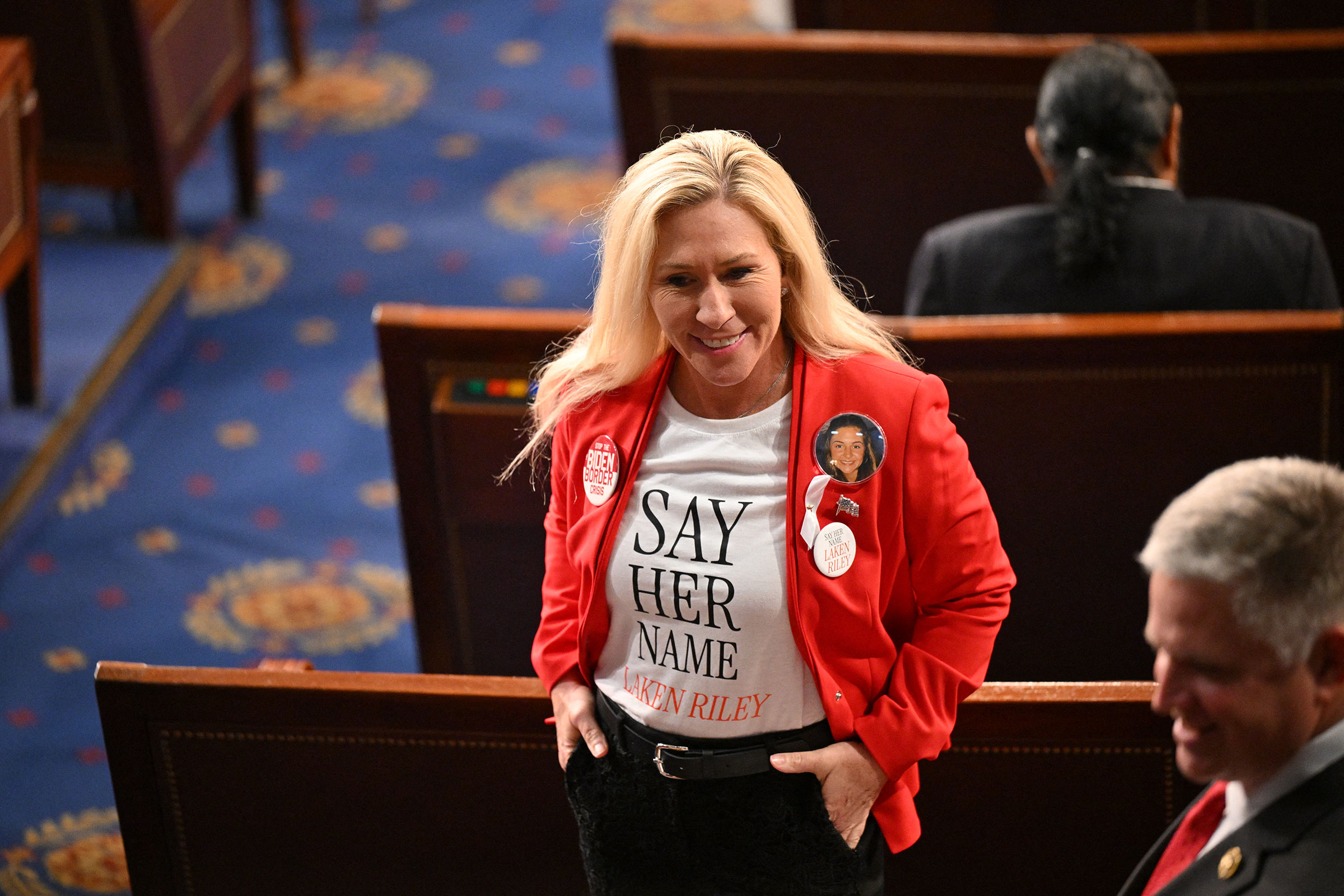 Rep. Marjorie Taylor-Greene wears a shirt and button showing slain Georgia college student Laken Riley ahead of US President Joe Biden's State of the Union address in the House Chamber of the US Capitol in Washington, DC, on March 7. 