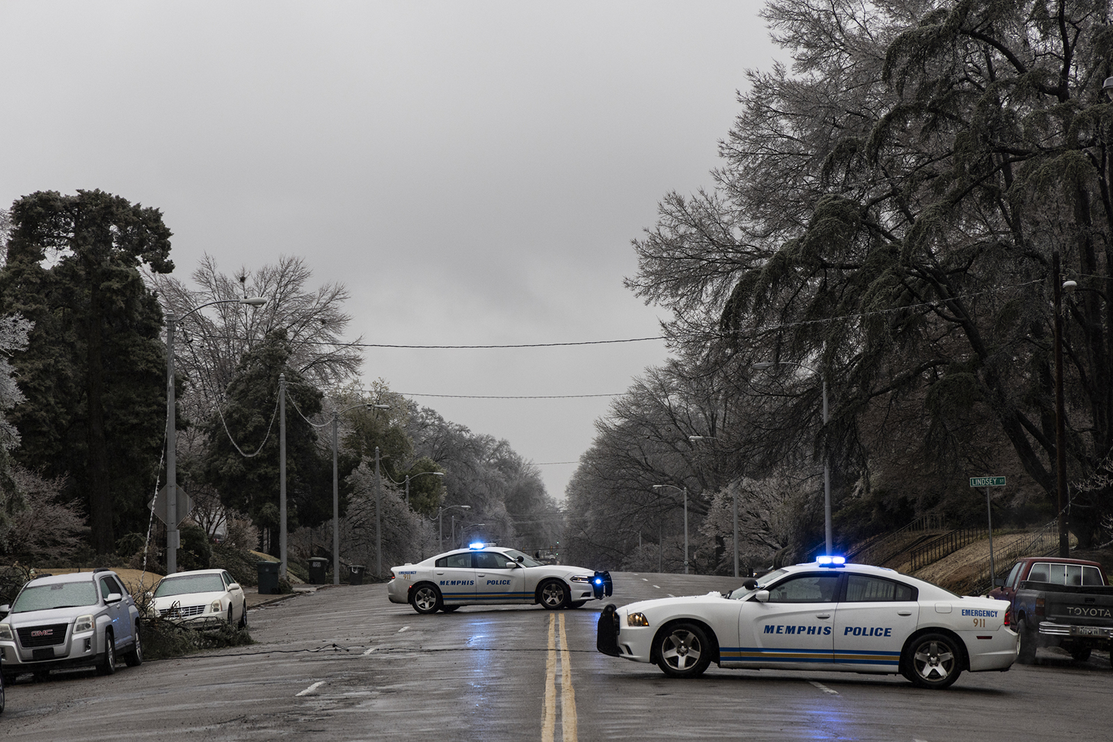 Memphis police officers block off Central Ave. where a power line was downed across the road on Thursday in Memphis, Tennessee. 